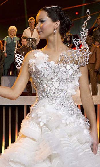 <p>Did Katniss Everdeen ever end up marrying Peeta Mellark in the <em>Hunger Games</em> movies? Debatable. But did Jennifer Lawrence get to wear a stunning, futuristic wedding dress either way? She sure did. </p>
