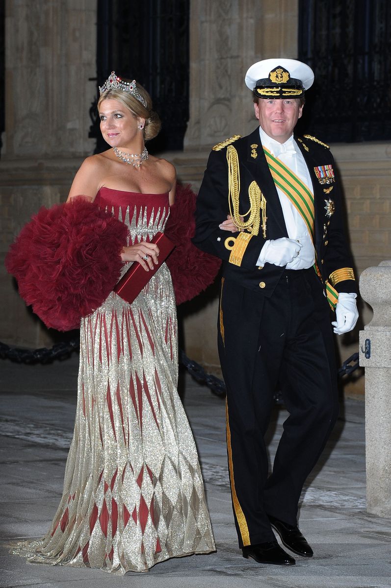 <p>It was all glamour when Maxima wore this glittering platinum and carmine dress, with a feathered stole and ruby-studded tiara to a gala dinner for the wedding of Prince Guillaume Of Luxembourg and Stephanie de Lannoy in Luxembourg.</p>