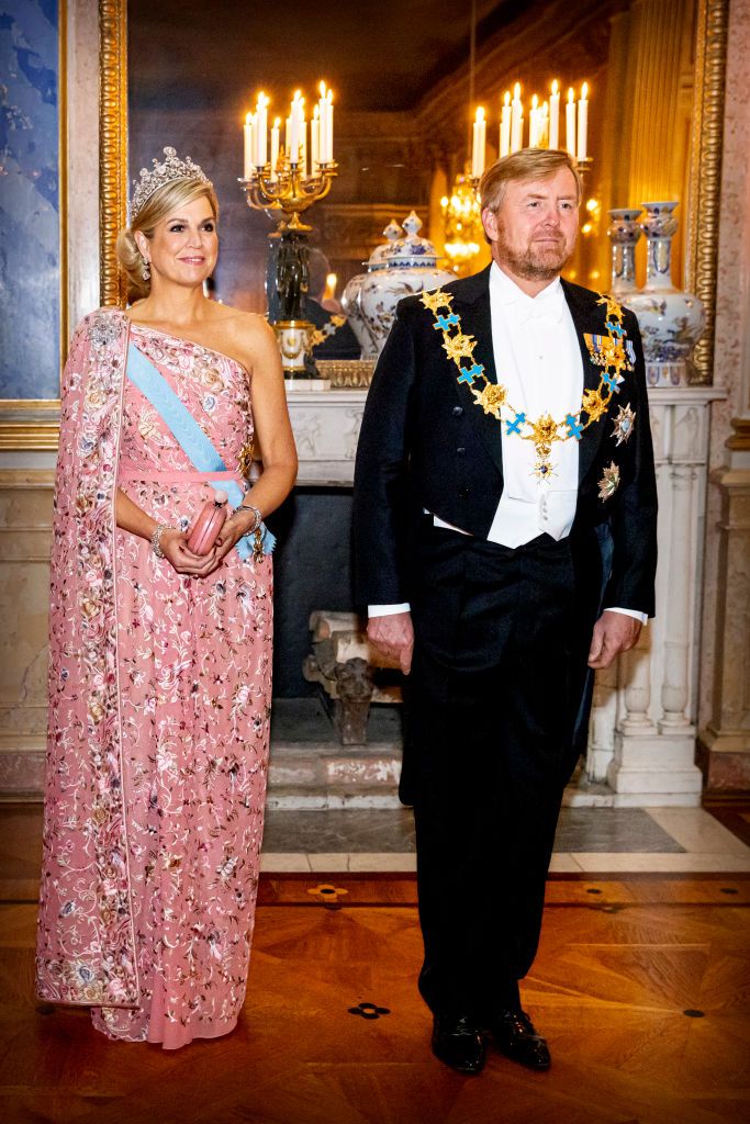 <p>Maxima brought some glitz with this one-shouldred caped pink gown during a state banquet in Stockholm, Sweden.</p>