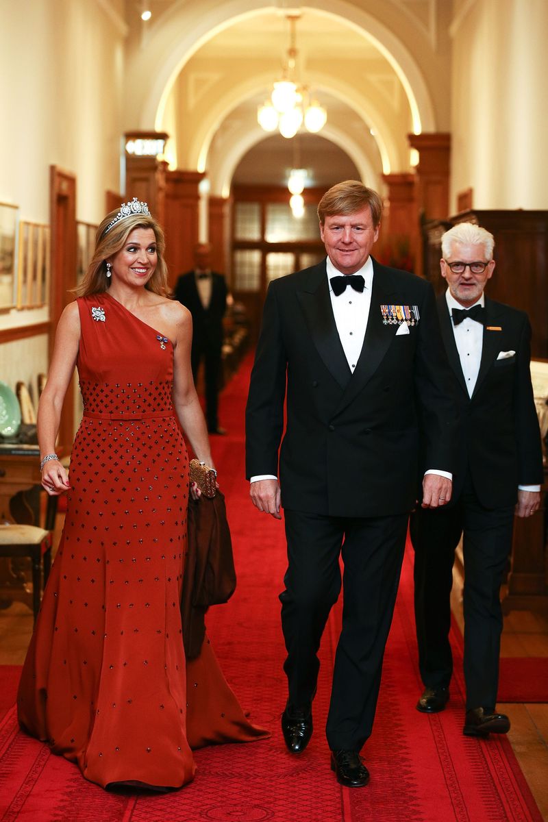 <p>For a state dinner at Government House in Wellington, New Zealand Maxima wore this embellished, one-shoulder gown in a brilliant scarlet shade. </p>