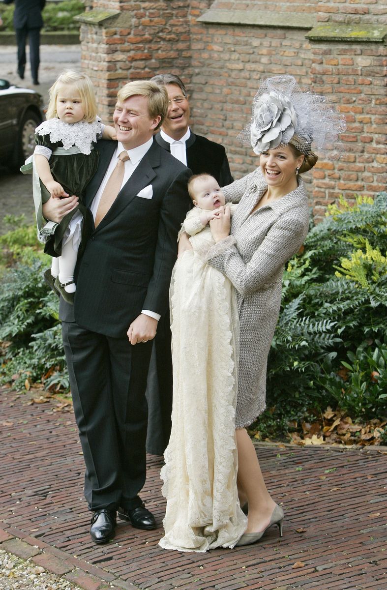 <p>To celebrate the baptism of their youngest daughter, Princess Alexia, the royal family posed for photos after the service in Wassenaar, The Netherlands. Maxima wore a grey boucle dress and floral fascinator for the big day. </p>