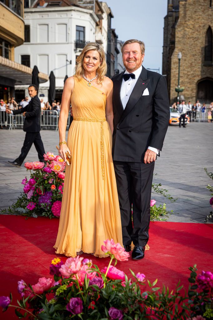 <p>Maxima and her husband, King Willem-Alexander, attended a concert in Brussels, Belgium during their state visit. Maxima chose a creamy marigold gown to the evening, with a one-shoulder silhouette and a belted detail. </p>