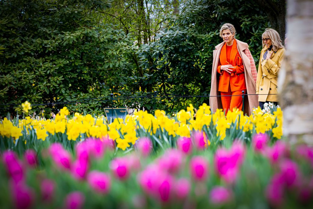 <p>During the French presidential visit, Maxima showed French First Lady Brigitte Macron around the Keukenhof flower park. For the day, she wore a coordinating ensemble of bold orange. </p>