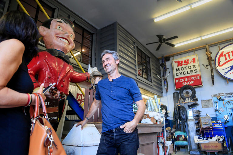 Mike Wolfe of "American Pickers" fame chats with customers at his store Antique Archaeology in LeClaire in 2018.