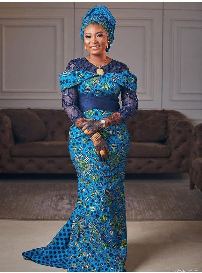 Smiling lady poses in her living room. Photo: Stylish Naija Source: Getty Images