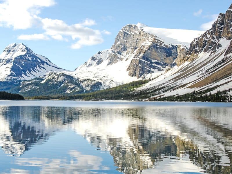 Bow Lake with reflection of rugged snowy mountains