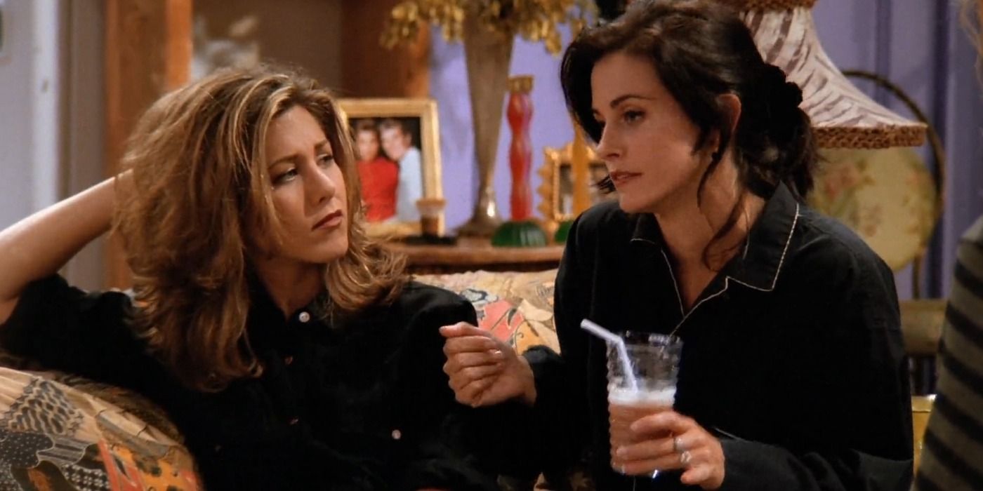 Rachel Green and Monica Geller sitting on the couch at their apartment in Friends