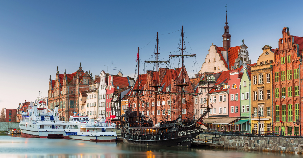 <p> It was here that the first shots of World War II were fired when a German battleship shelled the Gdansk peninsula and the Polish naval depot at Westerplatte. </p><p>After years of painstaking restoration, this thousand-year-old city remains a showpiece for classical European charm. </p> <p> Situated at the mouth of the Vistula River on the Baltic Sea, the city of Gdansk showcases some of Poland’s best features. </p><p>The charming, cobblestone streets of the city’s old town are lined with colorful homes, historical monuments, and architectural gems, which makes Gdansk a destination not to be missed. </p>