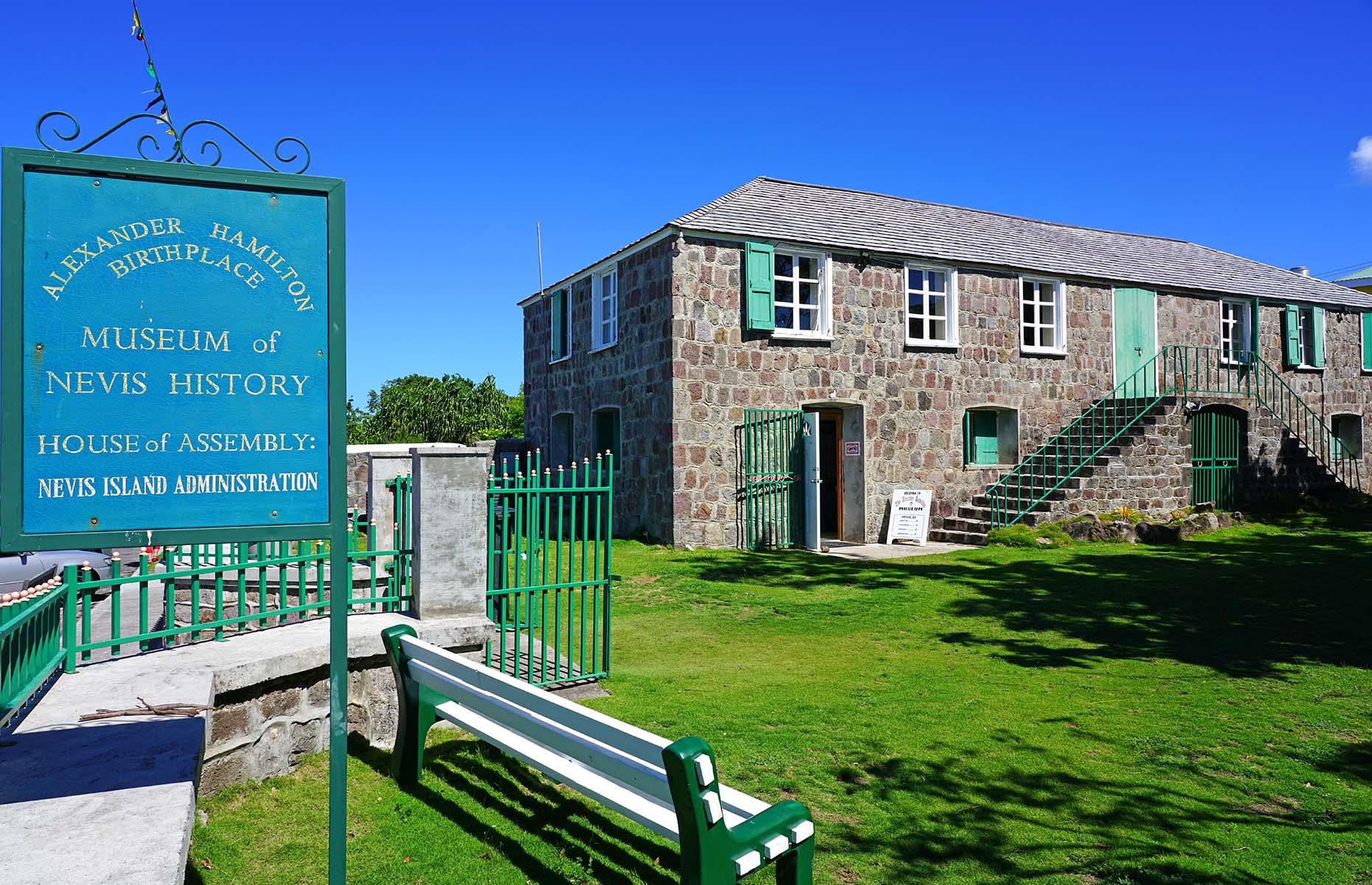 <p>If you’re passing through Charlestown, be sure to stop at the <a href="https://www.nevisheritage.org/">Museum of Nevis History</a> – housed in a quaint, Georgian-style building – to brush up on your local knowledge. Here, you can learn about the island’s original Amerindian inhabitants, the Arawak and the Carib, and find out more about the kingdoms that existed in Africa before slavery. The exhibition documents key milestones in Nevis’ history, from the slave trade to emancipation and independence, as well as shining a light on the African influences still present in the island’s language, food and music today.</p>