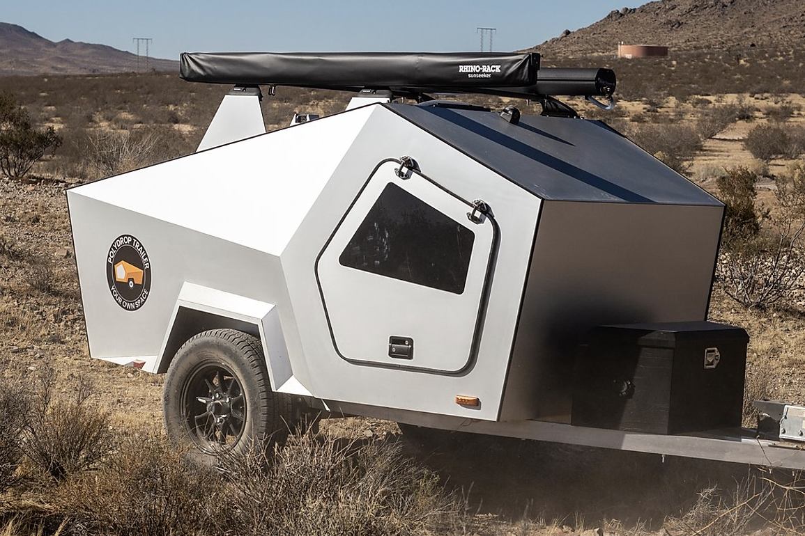 <p>A more angular take on the ubiquitous teardrop trailer profile, <a href="https://www.polydrops.com/">the Polydrop</a> looks like a tiny spaceship, especially with its gull-wing doors raised. At just over 12 feet long, with a double layer of insulated wood and aluminum skin, it's designed to be cozy, even in cold weather.  </p>
