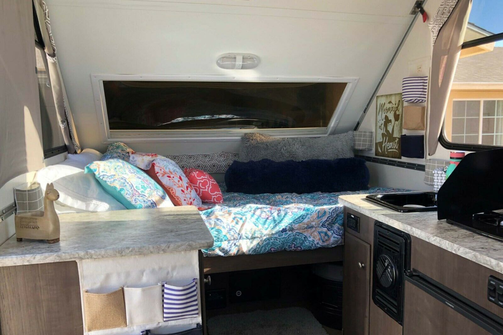 <p>Some models include a refrigerator, microwave, and stove-top. The company also makes a small-footprint, teardrop-like RV camper called the <a href="https://aliner.com/ascape-campers/">Ascape</a> with solar panel and flat-screen TV options. Plan to drop at least $29,000 for the latest Ascape models, depending on size and features.</p>