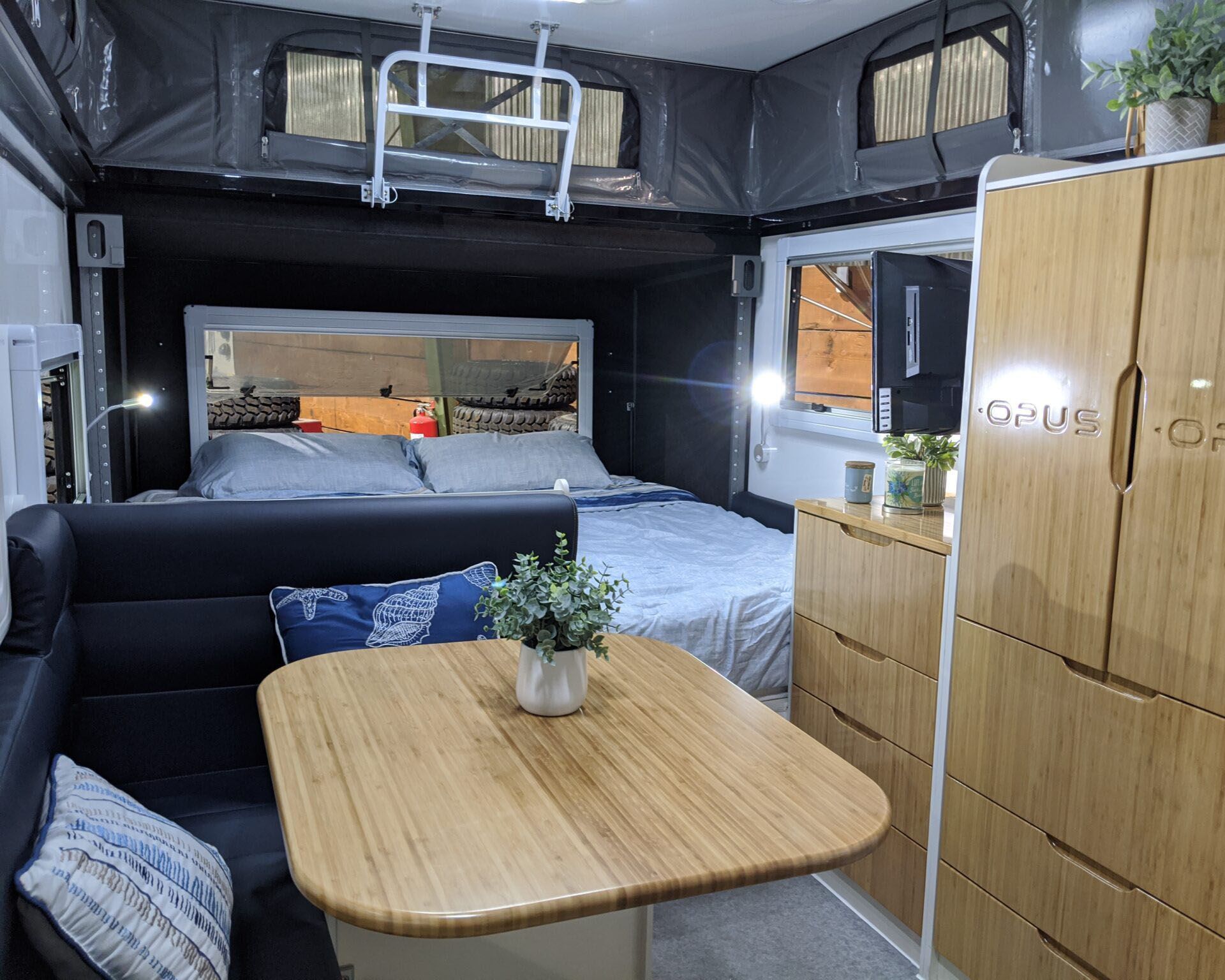<p>The OP's interior includes a leatherette dining area, shower/toilet combo with hot water availability, a king size bed and twin bunks, and plenty of available storage via a wardrobe and other storage areas. At nearly 5,000 pounds, it'll require a more robust vehicle to tow it but, as <a href="https://gearjunkie.com/camping/opus-op15-off-road-hybrid-camper-trailer">GearJunkie once noted</a>, with this many features, it "may be nicer than your home." Models start at $54,000.</p>