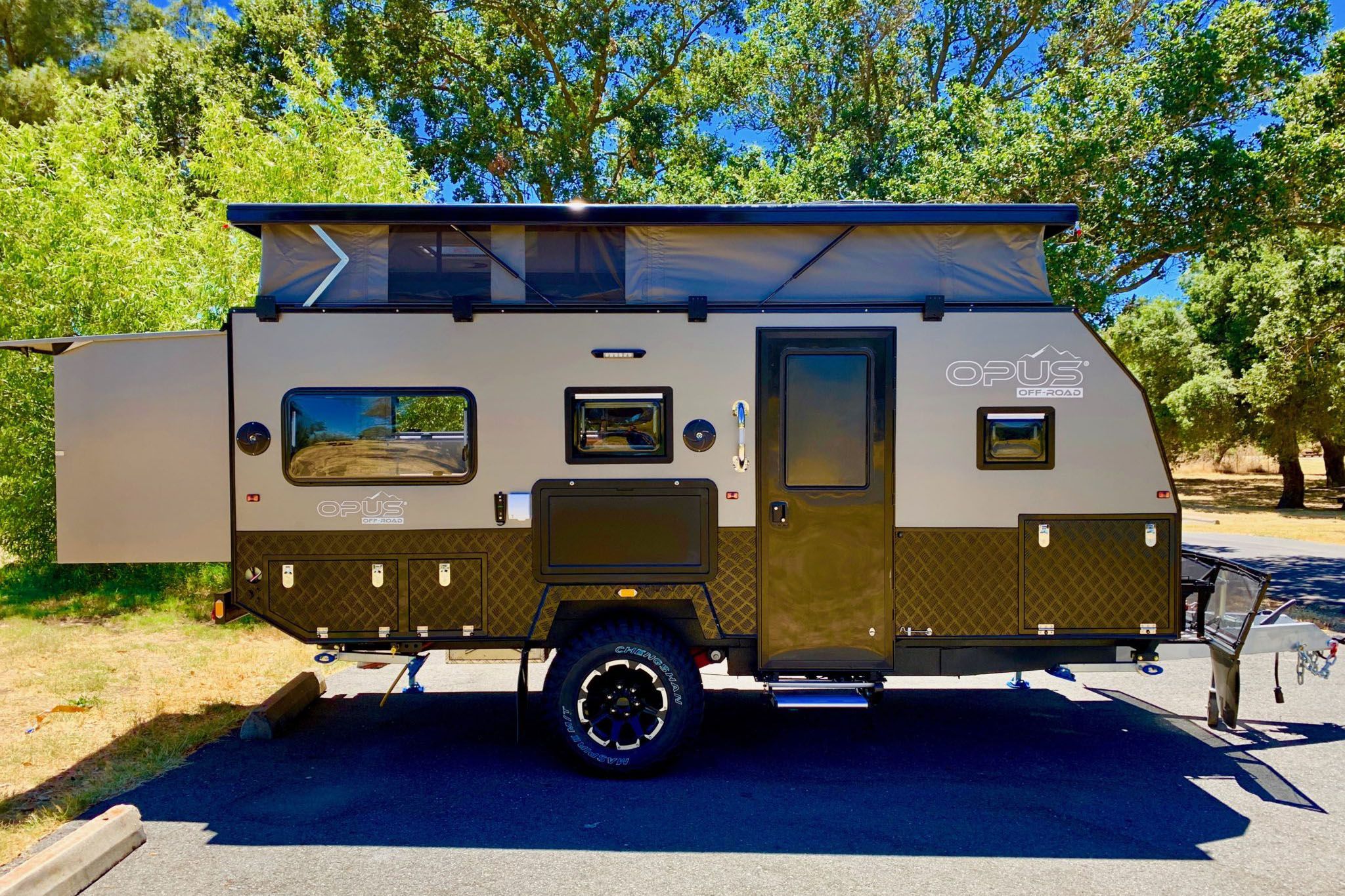 <p>Built with "tough luxury in mind," <a href="https://www.opuscamper.us/op15/">this tiny RV</a> includes a bamboo interior, a pullout stainless steel kitchen that includes a chopping board, prep deck and pantry access, as well as an electric Dometic cooler that has both refrigeration and freezing compartments, and a pop-up roof that provides extra headroom. </p>