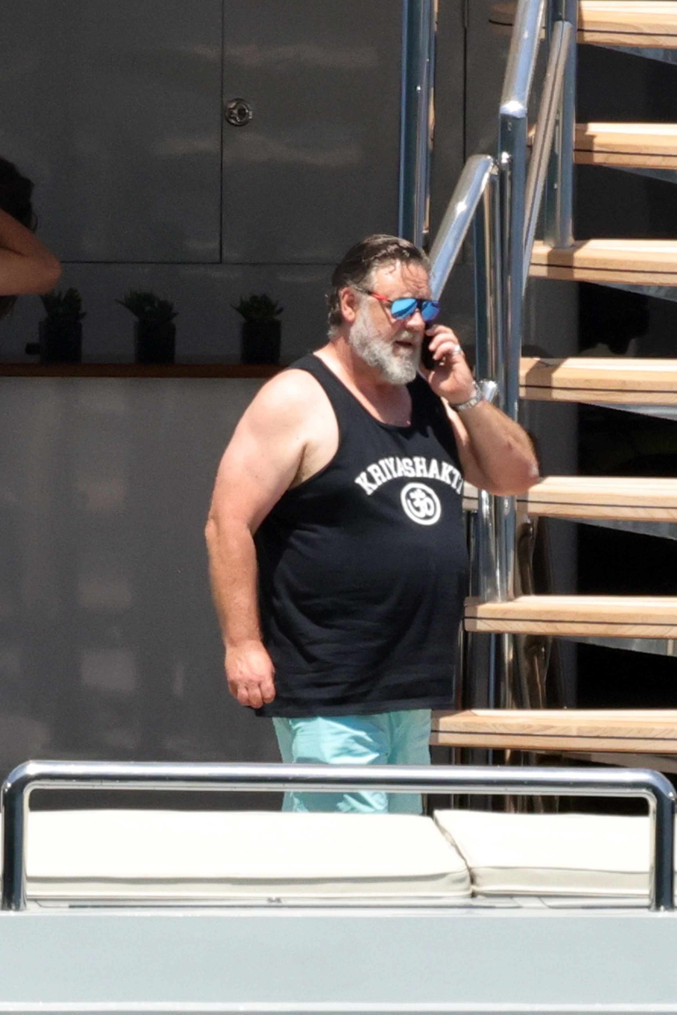 <p>Russell Crowe took a phone call while vacationing on a yacht with his sons and girlfriend Britney Theriot (not pictured) off the coast of the Italian island of Capri on July 10.</p>