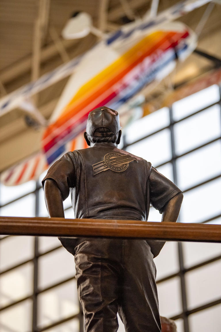 The sculpture of the late Tom Poberezny, designed to be looking up at the Christen Eagle aircraft he flew as part of The Eagles Aerobatic Team, in the EAA Aviation Museum in Oshkosh, Wisconsin.