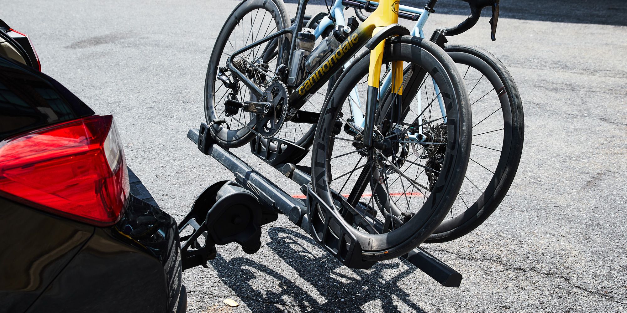 <p>A bike rack is a simple, but important piece of equipment. When you strap your pricey <a href="https://www.google.com/search?client=safari&rls=en&q=best+bikes+pop+mech&ie=UTF-8&oe=UTF-8">bicycle</a> to your even pricier car, SUV, or truck and drive through traffic, potentially at high speed or over bumpy roads, there are many opportunities for things to go horribly wrong.</p><p>And, as it turns out, bike racks are not entirely one size fits all: It pays to do your homework before investing in one, so you can drive with confidence when you bring your bikes on a road trip. Whether you’re looking for a trunk, hitch, or <a href="https://www.popularmechanics.com/adventure/outdoor-gear/g37268734/best-roof-racks/">roof rack</a>, you should pick your bike rack carefully. Luckily, we’ve done the trial and error for you. We can help you figure out what to look for in a bike rack, and have narrowed down the options to 10 excellent picks that should help most riders get their bikes from point A to point B.</p><p class="body-tip"><strong>Bike Trip!</strong> <a href="https://www.popularmechanics.com/adventure/outdoors/g3045/best-bike-helmets/">Best Bike Helmets</a> ● <a href="https://www.popularmechanics.com/adventure/outdoor-gear/g41356552/bike-tool-kit/">Best Bike Tool Kits</a> ● <a href="https://www.popularmechanics.com/adventure/outdoor-gear/g3046/best-bike-lights/">Best Bike Lights</a></p><h2 class="body-h2">Best Bike Racks</h2><ul><li><strong>Best Overall: </strong><a href="https://go.redirectingat.com?id=74968X1553576&url=https%3A%2F%2Fwww.rei.com%2Fproduct%2F190985%2Fthule-t2-pro-xtr-2-bike-hitch-rack%3Fcm_mmc%3Daff_AL-_-40661-_-55097-_-NA%26avad%3D55097_c31b03395&sref=https%3A%2F%2Fwww.popularmechanics.com%2Fadventure%2Foutdoors%2Fg3146%2Fbest-bike-racks%2F">Thule T2 Pro XTR Hitch Rack</a></li><li><strong>Best Value:</strong> <a href="https://www.amazon.com/dp/B07GWCQGLV?tag=syndication-20&ascsubtag=%5Bartid%7C10060.g.3146%5Bsrc%7Cmsn-us">Ikuram R 2 Hitch Bike Rack</a></li><li><strong>Best for Road Bikes:</strong> <a href="https://go.redirectingat.com?id=74968X1553576&url=https%3A%2F%2Fwww.rei.com%2Fproduct%2F871149%2Fyakima-ridgeback-4-bike-hitch-rack%3Fcm_mmc%3Daff_AL-_-40661-_-55097-_-NA%26avad%3D55097_f31af2405&sref=https%3A%2F%2Fwww.popularmechanics.com%2Fadventure%2Foutdoors%2Fg3146%2Fbest-bike-racks%2F">Yakima RidgeBack 4-Bike Hitch Rack</a></li><li><strong>Best for E-bikes:</strong> <a href="https://www.amazon.com/Hollywood-Racks-Destination-Bike-Hitch/dp/B073113CFH?tag=syndication-20&ascsubtag=%5Bartid%7C10060.g.3146%5Bsrc%7Cmsn-us">Hollywood Racks Destination E Hitch Rack</a></li><li><strong>Best for Families:</strong> <a href="https://1up-usa.com/product/equipd-double">1Up Equip-D Double Hitch Rack</a></li></ul><blockquote class="body-blockquote"><strong>The Expert: </strong>I’ve spent decades riding bikes of all varieties over road and trail. That has also led me to carry lots of bikes atop many kinds of vehicles. I’ve used bike racks of every format with vehicles of every arrangement—cars, trucks, SUVs, vans, and even RVs—and have experienced a wide spectrum of the best and worst products. I have applied this experience to review bikes, bike racks, and a range of other cycling gear for <em>Bicycling</em>, <em>Popular Mechanics</em>, <em>Popular Science, the Manual</em>, and more.</blockquote><h2 class="body-h2">What to Consider When Buying a Bike Rack</h2><h3 class="body-h3">Compatibility</h3><p>The first thing you need to check when looking at a bike rack is whether it will properly support your bike and install correctly on your vehicle. Different racks are designed for different vehicle types, so a trunk rack made for SUVs may not fit right on a sedan. Some racks offer cross-compatibility, but it’s always worth it to check. Most bike racks will clearly indicate whether they’re designed to fit on specific types of vehicles, such as SUVs, pickups, sedans, or hatchbacks. They may occasionally specify make and model as well.</p><p>Figuring out whether the rack can handle your bike may be a bit trickier. Some racks are too narrow for fat tires. Others can’t fit road bikes or step-throughs. <a href="https://www.popularmechanics.com/adventure/outdoors/g19747012/best-electric-bikes/">E-bikes</a> make things even more complicated, given their extra weight and the wide range of accessories that can be easily destroyed in transit. (In general, baskets, fenders and other items protruding over the front wheel are all but impossible to load onto certain racks without risking damage.) </p><p>Make sure to read a rack’s description and specifications carefully before buying one, so you can make sure to buy one that supports your bike. I’ve pointed out certain notable limitations in our top picks, but it never hurts to double-check for yourself.</p><h3 class="body-h3">Types of Bike Racks</h3><p>Bike racks come in a few different shapes and sizes. Beyond their compatibility with different types of cars, each design comes with certain benefits and drawbacks. Some are easier to load, while others may naturally be able to handle more weight, for example. Here are a few things to keep in mind when picking what to put on your vehicle.</p><p><strong>Hitch racks</strong>, which attach by inserting directly into your vehicle hitch receiver, are easy to install and access. Unlike a roof rack, you don’t need to lift your bikes overhead. Typically compatible with 1¼-inch and 2-inch hitch receivers, they frequently feature integrated locks with cables to secure your bike to the rack. Many are also hinged so they can fold up and out of the way when not in use or tilt bikes out of the way to provide trunk access.</p><p>If you've sworn off hitch racks because of an older model, we understand but it’s worth pointing out that modern designs have dramatically reduced the amount of rattling and unwanted vibration.</p><p><strong>Roof racks</strong> typically feature a full system that bolts onto your vehicle’s factory-installed roof rails and cross bars via a set of individual fixture points. If you don’t have a roof rack (and don’t want one), some models will attach to your ride using suction cups that vacuum-seal to a flat roof. Roof racks tend to be the best option if you don’t have a trailer hitch.</p><p>Some roof racks require you to remove your front wheel, which reduces how high the bike sits on your car. If you go this route, make sure to check that the rack is compatible with your bike’s fork, particularly if it has a thru-axle. Given all that, we recommend staying away from a roof rack if you have an especially tall or heavy bike.</p><p>Also, make sure to get at least a rough estimate of the height of your vehicle with your bikes on it, so you know whether you can enter tunnels, pass under bridges, or enter parking garages without issue.</p><p><strong>Trunk racks </strong>tend to be the most affordable type of bike rack. They attach to the back of your vehicle via straps and hooks, which is great if you want something removable. On the other hand, they leave the back of your car susceptible to dings and scratches, as they mount the bikes closer to your trunk. The mounting points can also create wear marks on your vehicle.</p><p>Trunk racks usually hold bikes beneath their top tubes, so they won’t work with step-throughs and some other designs. E-bikes are typically too heavy for trunk racks. They’re also not as secure as other racks, since they aren’t fixed in place as securely.</p><p><strong>Tailgate Pads </strong>specialty racks for pickup trucks, where the bike hangs over the back of the tailgate. With a tailgate pad you can carry as many as seven bikes, depending on the size of your cargo bed, making them a great choice for families and large groups. Most pads use a Velcro and cradle system that anchors the bikes to the bed and keeps the forks from moving and causing damage, while the grooves in your truck bed hold the rear tires in place.</p><p>Tailgate pads aren’t especially theft-proof on their own, but you can use a <a href="https://www.bicycling.com/bikes-gear/a20017112/best-bike-locks/?gclid=Cj0KCQjwnrmlBhDHARIsADJ5b_mrmuiMsws6aZTuLqB76nkZ42TvZCydWr_JX-qzEDLjK03Iod9Ly-IaAiCTEALw_wcB">long cable lock</a> to secure your bikes to an anchor point. They’re a convenient and removable option, but keep in mind that the bikes will be sitting in the bed, which can make it difficult to load additional cargo.</p><h3 class="body-h3">Weight Limit</h3><p>Weight isn’t a looming consideration for conventional road bikes, but you may want to check the weight limit of your bike rack if you plan to move multiple mountain bikes, or bikes with lots of accessories attached.</p><p>E-bikes, on the other hand, are heavy, and many racks simply aren’t strong enough to hold them. A number of companies have begun producing specialty racks for heavy e-bikes, which may be helpful. In any case, though, you should check the weight of a bike rack before you buy it to make sure it can handle the load you plan to put on it.</p><h3 class="body-h3">Security</h3><p>Many bike racks come with security features to ensure that your bikes stay put when you’re parked, including integrated locking cables or locking tire/fork attachments. Depending on how and where you intend to use it, this might not be much of an issue for you. But if security is a concern, look for a rack that locks.</p><h3 class="body-h3">Special Features</h3><p>We never say no to an extra quality-of-life feature or two. Some racks—especially newer models designed for heavy e-bikes—come equipped with ramps for easy loading. Some high-end hitch racks can be dropped at an angle to provide access to the trunk or tailgate. Keep an eye out for features that are relevant to your needs.</p><h2 class="body-h2">How We Selected The Best Bike Racks</h2><p>To select the best bike racks, I drew from many years of firsthand experience testing bike racks from a wide variety of brands and formats. I’ve tried racks that rattled badly and fell off entirely, and I’ve tested others, like the <a href="https://go.redirectingat.com?id=74968X1553576&url=https%3A%2F%2Fwww.rei.com%2Fproduct%2F190985%2Fthule-t2-pro-xtr-2-bike-hitch-rack&sref=https%3A%2F%2Fwww.popularmechanics.com%2Fadventure%2Foutdoors%2Fg3146%2Fbest-bike-racks%2F">Thule T2 Pro XTR</a>, that held up solidly through thousands of miles of driving, frequently over rough, bumpy roads.</p><p>This list also leans heavily on the experts at <em>Bicycling</em>, who have spent years using and <a href="https://www.bicycling.com/bikes-gear/a25437985/best-bike-racks/">testing bike racks</a> from a variety of manufacturers. Our selections represent a wide range of vehicle and bike compatibilities, styles, and budgets. In the most recent update, I took into account the latest product releases as well as the rising popularity of ebikes, which skewed some selections toward heavier weight capacities. Here are 10 of the best bike racks on the market right now.</p>