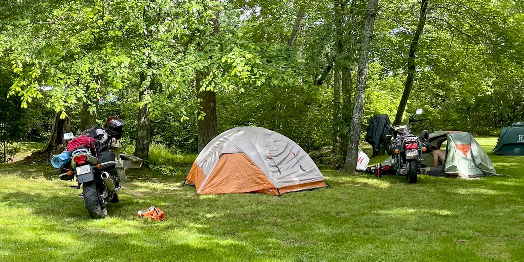 <p>There’s something just plain wonderful about the combination of camping and motorcycles. The common thread is freedom—there are some places out there that just can’t be reached via four wheels, and those places tend to be just a little short on valet parking or penthouse suites.</p><p>If you’re one of the many riders who made the switch from sportbikes or cruisers to “adventure bikes” in the past few years, you might be wondering how to get more adventure out of your bike – in which case camping is <em>definitely </em>for you. Or you could be one of those retro riders who delights in crossing the country via cafe racer or a restored vintage air-cooled standard bike, stopping for evenings under the stars and the kind of vistas you can’t see in a parking lot. Either way, you’ll want the right gear. Camping on a bike means being intentional about your choices, because bulk is your mortal enemy and weight only slows the ride. With that in mind, we’ve chosen some of the best ways to make the most of your rambles, both on and off-road.</p><h2 class="body-h2">Best Motorcycle Camping Gear</h2><ul><li><strong>Best Affordable Tent With Bike Cover: </strong><a href="https://www.amazon.com/dp/B08T91ZWJG?linkCode=ogi&tag=syndication-20&ascsubtag=%5Bartid%7C10060.g.42760020%5Bsrc%7Cmsn-us">Wolf Walker 2-Person Motorcycle Tent</a></li><li><strong>Best Affordable Two-Person Tent: </strong><a href="https://www.amazon.com/dp/B084LLQ14Q?tag=syndication-20&ascsubtag=%5Bartid%7C10060.g.42760020%5Bsrc%7Cmsn-us">Klymit Cross Canyon</a></li><li><strong>Best Budget One-Person Tent: </strong><a href="https://www.amazon.com/Clostnature-1-Person-Tent-Backpacking-Ultralight/dp/B0893QB42Z/ref=sr_1_5?keywords=one%2Bperson%2Btent&sr=8-5&th=1&tag=syndication-20&ascsubtag=%5Bartid%7C10060.g.42760020%5Bsrc%7Cmsn-us">Clostnature 1-Person Tent</a></li><li><strong>Best Boutique Lightweight Cooking Gear: </strong><a href="https://www.amazon.com/dp/B000AR2N7Q?linkCode=ogi&tag=syndication-20&ascsubtag=%5Bartid%7C10060.g.42760020%5Bsrc%7Cmsn-us">Snow Peak Trek 700 Pot</a></li><li><strong>Best Camping Chair: </strong><a href="https://www.amazon.com/dp/B09Q7QSXH5?linkCode=ogi&tag=syndication-20&ascsubtag=%5Bartid%7C10060.g.42760020%5Bsrc%7Cmsn-us">CLIQ Folding Chair</a></li></ul><blockquote class="body-blockquote"><strong>The Expert: </strong>I’ve been riding motorcycles for twenty-nine years, everywhere from Seattle to Fort Lauderdale, and I’m always searching for ways to extend and enhance the experience. Along the way, I’ve written about cars and motorcycles for Esquire, Road & Track, and Car & Driver, among others. As a rule, I don’t enjoy camping, so if I’m going to skip the hotel I need to be certain that I won’t be tossing and turning all night.</blockquote><h2 class="body-h2">How to Pick Great Motorcycle Camping Gear</h2><p>When prepping for a long camping trip, it’s tempting to start with what’s compatible with your bike. First and foremost, however, it has to work for you<em>. </em>That means choosing a sleeping bag that’s warm enough for the coldest weather you might see, a tent that’s big and comfortable so you can get a good night’s sleep, and the right cooking gear to make what’s on your campfire menu. It has to meet your needs, and <em>then </em>it has to fit. Don’t be ashamed to try everything at home extensively before taking it on the road.</p><h3 class="body-h3">What Kind of Camping Gear Works Best For a Long-Distance Ride?</h3><p>The traditional minimum loadout for camping bikers is a rolled sleeping bag and a small cooking kit. It’s enough to get you through fair-weather nights, but anything more severe than that will be unpleasant. The next logical step, if you can fit it, would be a small collapsible tent, which will keep the weather off you.</p><p>Still have room? A larger tent with a motorcycle shelter makes mornings more pleasant, and an <a href="https://www.popularmechanics.com/home/g37022927/best-air-mattress/">air mattress</a> can make camping on rough ground tolerable for people with back problems or nagging injuries. Most riders will use any extra space they have after <em>that </em>for a broader variety of clothes, but it’s also worthwhile to add a propane or Sterno stove to improve your camping cuisine.</p><h3 class="body-h3">Your Bike Is Your Backpack</h3><p>Before you make any plans to go camping with your motorcycle or buy gear for the trip, it’s critical to really understand what will actually fit on your bike. Take the time to measure all the available storage.</p><p>A new BMW GS with extra-large Jesse boxes will have a lot more room than a retro rider on a slick-side Seventies Honda. Also, very few saddlebags or top boxes are precisely square, so learn where the “pinch points” are.</p><p>Once you know how much storage you have, remember that you should only use about half to three-quarters of that space for your camping gear. It’s easy to forget that you’ll need a little extra space for a few personal effects, supplies, and any souvenirs you pick up along the way.</p><p>Get your “packout” together–all the things you’re taking on the ride, including clothes and tools–and try putting it all in the bike until it’s second nature. If you can’t do it easily in your own driveway on a sunny day, you won’t be able to do it before sunrise in the rain. Don’t expect things to get easier once you're on the road, because they won’t.</p><p>Finally, if you’re using a traditional rear-seat bedroll-and-stack, like the bike campers of yore, you should also go on a few test rides around your area at freeway speeds to ensure that your setup doesn’t slip, slide, or just plain disappear from the bike. Better to find out the bad news when you’re close to home.</p><h3 class="body-h3">Adjust To Your Trip</h3><p>A little intelligent consideration of your planned trip will go a long way towards ensuring the best experience. The desert gets cold at night, which is something many Midwesterners (like your author) tend to forget until it’s too late. Both the Northeast and Pacific Northwest have unpredictable rain, something to consider when you’re choosing a tent. Pack for the length of your trip and the likely conditions along the way.</p><p>Preparing for the weather includes picking (and making room for) the right clothes. If you leave home with a full Aerostitch suit, heated gloves, and a neck gaiter, you will need to make sure and leave room to stow it when the weather gets warm. Don’t think you’ll just “stuff it in there,” because you won’t. It’s counterintuitive, but a <a href="https://www.popularmechanics.com/adventure/outdoor-gear/g43234721/best-motorcycle-jackets/">motorcycle jacket</a> is far bulkier than a tent.</p><h2 class="body-h2">How We Evaluated</h2><p>After years of motorcycle touring, I have an idea of what works and what doesn’t. In addition to my own personal testing, I reached out to riders who do ADV (adventure) touring and primitive camping to hear their stories and get expert feedback on the best choices for different motorcycles. We prioritized value and affordability, without sacrificing durability on the road. Preference was given to items that are light and compact. When possible, we chose soft-sided items over rigid ones, because most motorcycle luggage boxes are irregular and rigid items waste space.</p>