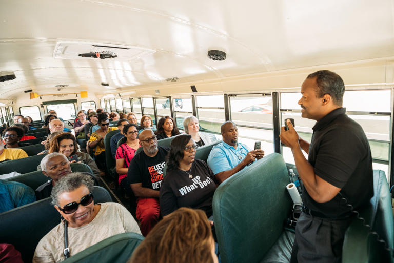 Ken Coleman, a Detroit historian and journalist, is shown giving a bus tour in 2019.