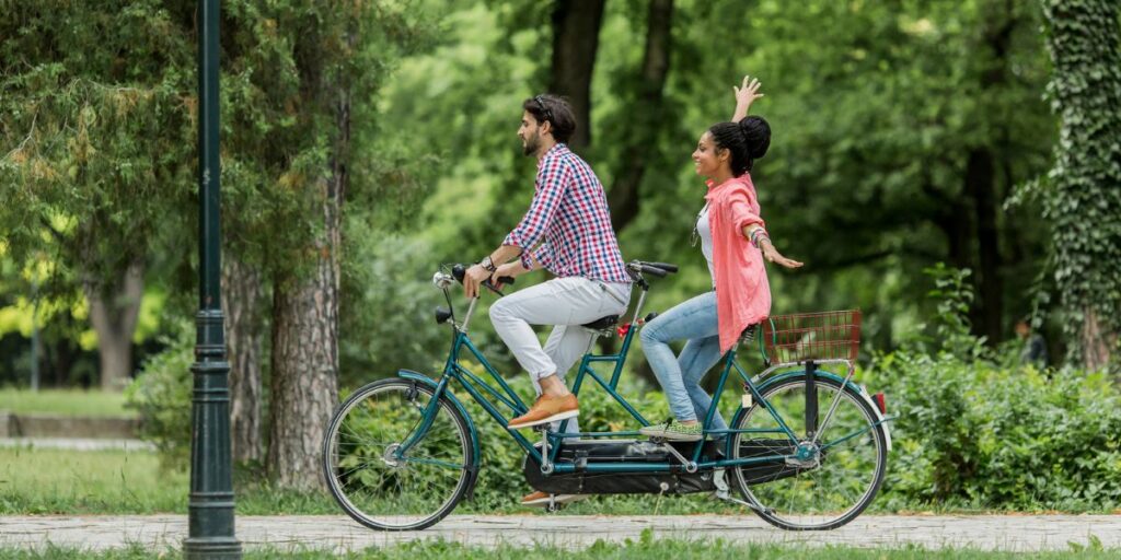 <p>A tandem e-bike experience offers far more than a novel way to get from point A to B. It allows two people to share the physical effort, making it feasible to traverse greater distances and tackle more challenging terrains. But the advantages go beyond the practical.</p> <ul>   <li>Bonding Opportunity: Riding a tandem e-bike necessitates communication and cooperation, forging a unique bond between the riders. Whether it’s a couple, a parent and child, or two friends, the shared experience can <a href="https://www.mass.gov/service-details/defining-healthy-relationships" rel="noopener">strengthen relationships</a>.</li>  </ul> <ul>   <li>Shared Memories: The shared experience of navigating a route together, the conversations along the way, and the shared triumph of reaching your destination create lasting memories.</li>  </ul> <ul>   <li>Enhanced Accessibility: For those who may be less confident or able to cycle, a tandem e-bike allows them to be part of the adventure. They can contribute as much or as little as they feel comfortable, ensuring an inclusive experience.</li>  </ul> <p>In essence, tandem e-bikes share not only the workload, but also the joy, challenges, and triumphs of the journey, creating a truly shared adventure.</p>