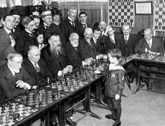 8 year-old chess prodigy Samuel Reshevsky defeating several masters at the same time in France, 1920.