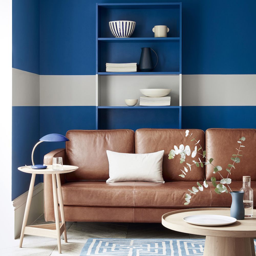 <p>                     A nautical palette of blue and white has always been a firm decorating favourite, and this smart band of white gives a whole new take on the traditional sailors stripes! Pairing it with a soft tan leather sofa and adding washed wood furniture brings a softness and warmth to this smart colour palette.                   </p>