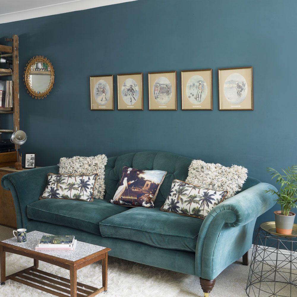 <p>                     There's a fine line between traditional and tired, but it can be completely avoided if you are confident with colour. This strong teal brings a certain amount of heritage to this living room, but it simultaneously feels fresh.                   </p>                                      <p>                     Matching the sofa and the walls emboldens the look and creates a strong backdrop where it's possible to mix up antiques with modern pieces without the overall effect being messy.                   </p>