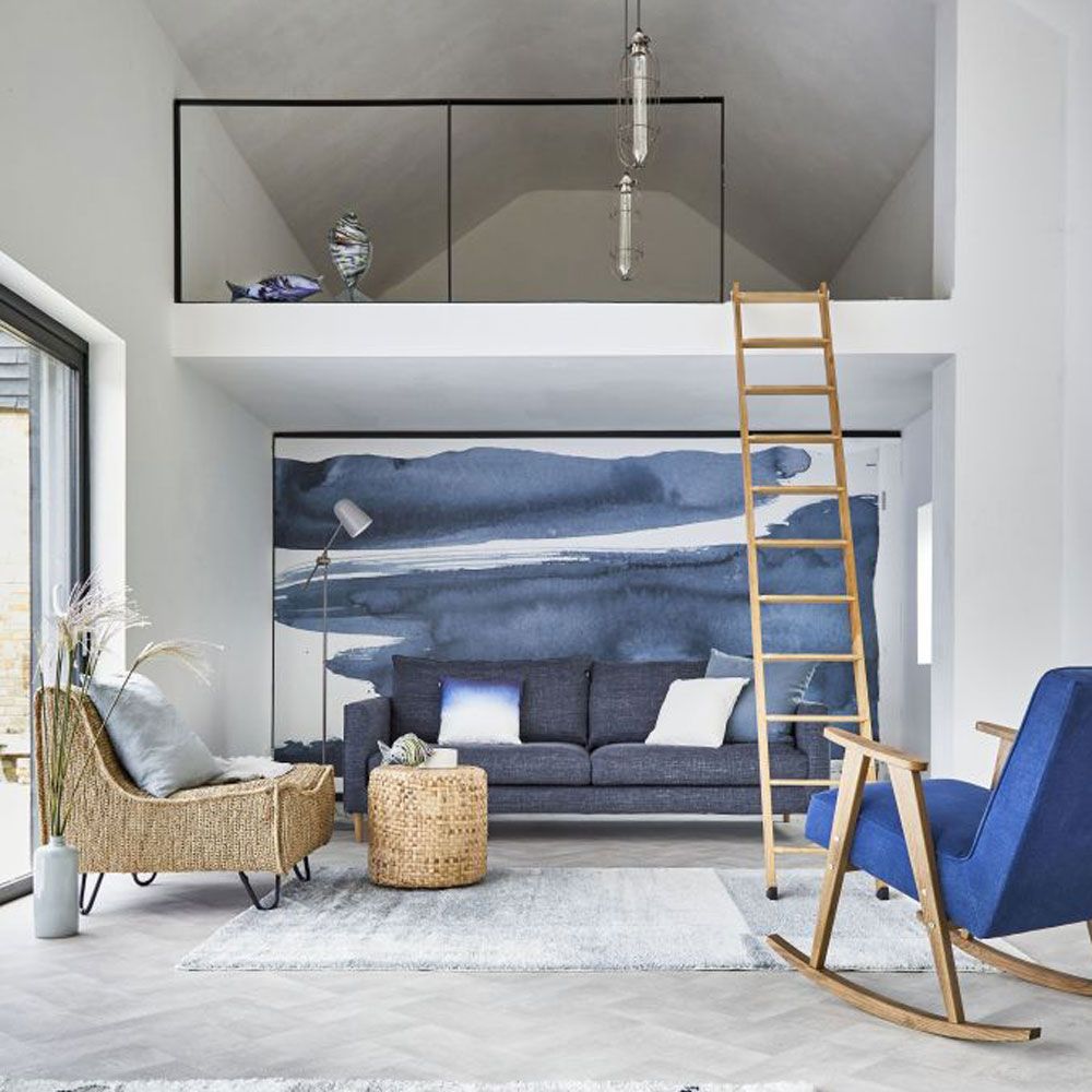 <p>                     Forget the classic stripes. An inky watercolour mural will evoke seascapes whilst avoiding the cliche coastal prints. There’s no need to stick to one shade of blue either, combine everything from a sky blue to indigo, with a denim sofa and cobalt chair, to create a softer, blended scheme.                   </p>                                      <p>                     Work in a casual vibe using rattan and seagrass pieces to channel a far flung sense of coastal style.                   </p>