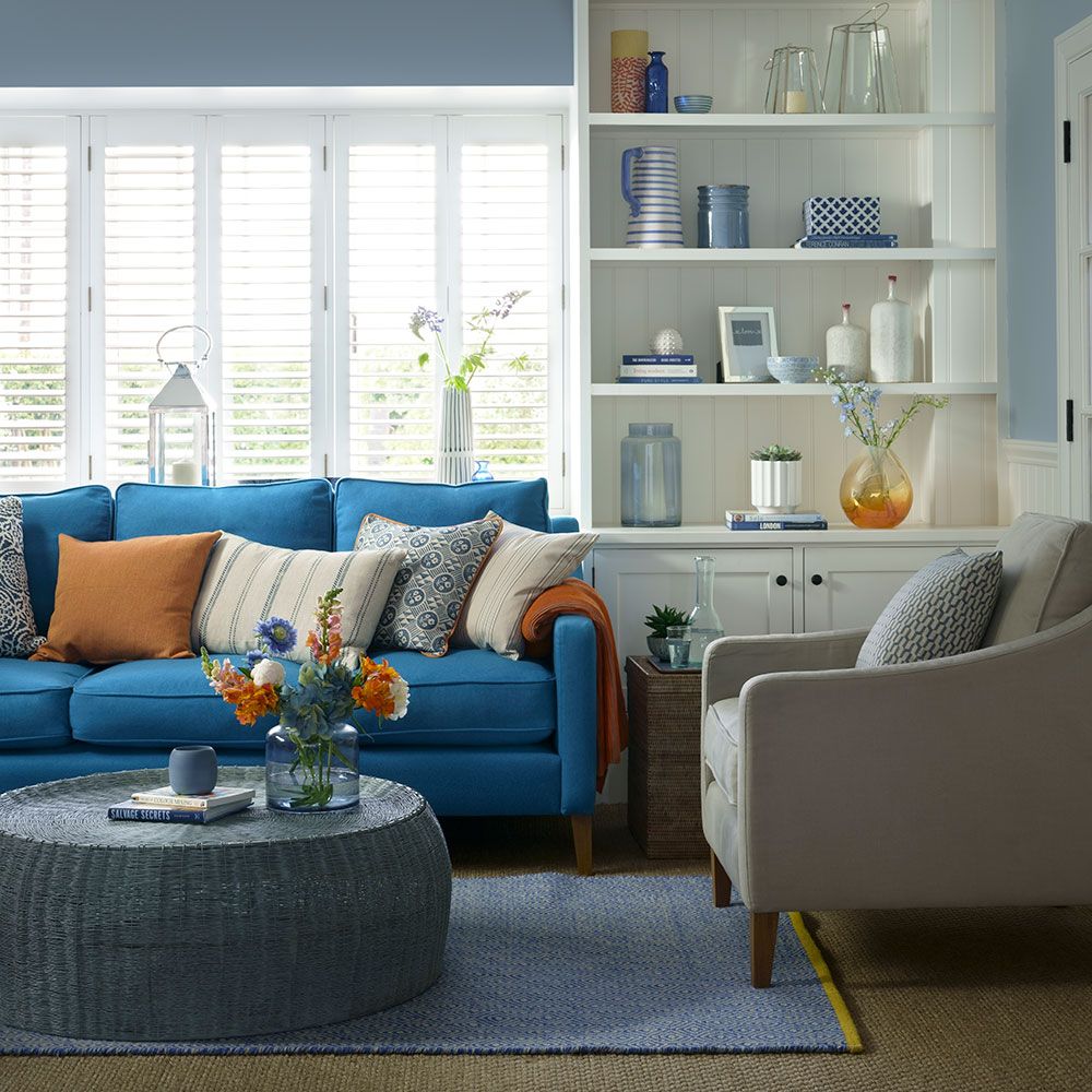 <p>                     Here, a vibrant turquoise blue sofa pops against a soothing backdrop of denim blue, for our take on modern coastal.                   </p>                                      <p>                     Stonewashed blues like these are the perfect foundation for classic styles of furniture, the white dresser being a prime example. It's a good idea to reflect them in the accessories in display.                   </p>