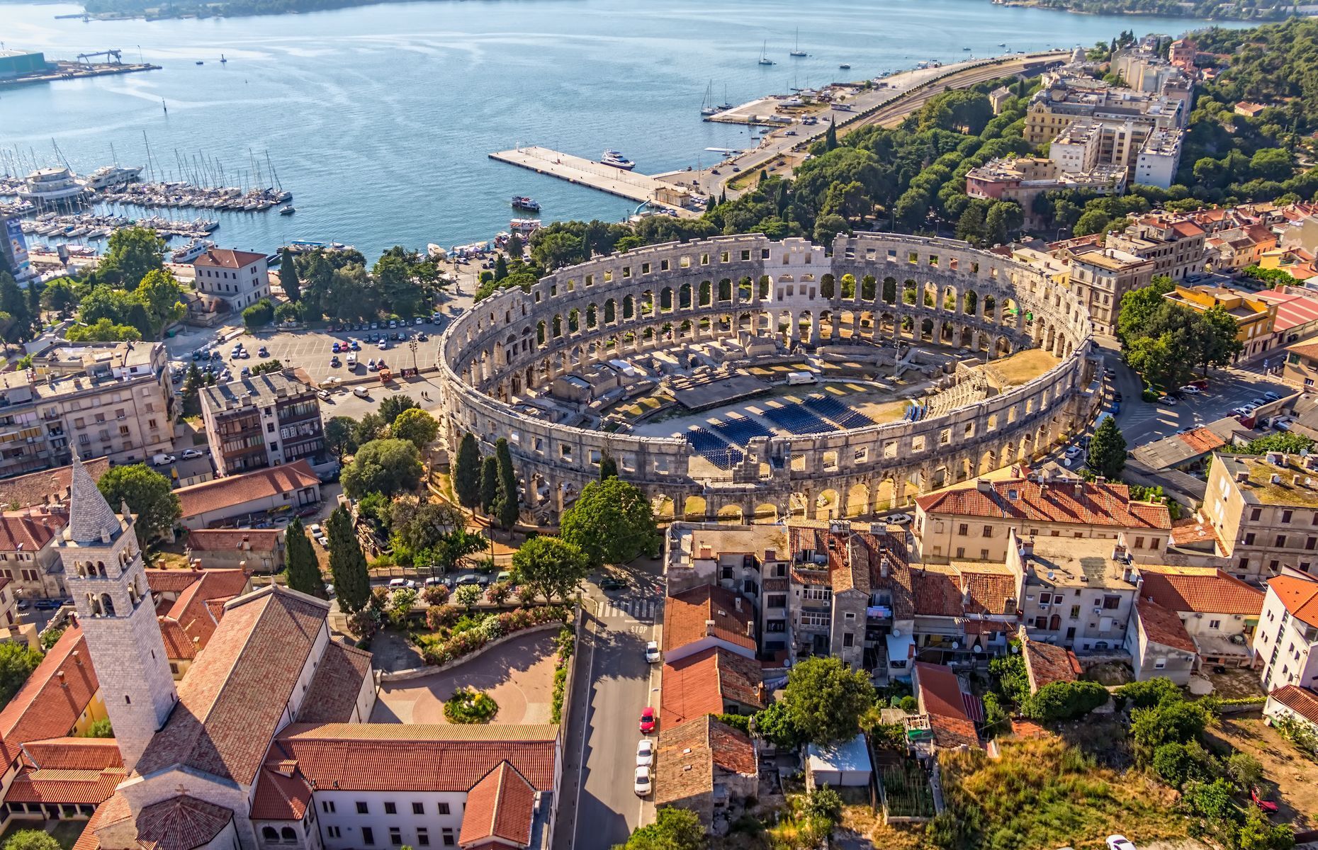 If Rome is on your bucket list, <a href="https://visitpula.croatia.hr/en-gb" rel="noreferrer noopener">Pula</a> is a great alternative and much more affordable than the Italian capital! Its amphitheatre will not only remind you of the famous Colosseum, but you’ll also definitely feel a Roman influence in the city’s history and archaeological treasures. This magnificent seaside resort also boasts sublime beaches, such as Valkane and Verudela, where you can relax and soak up the sun.