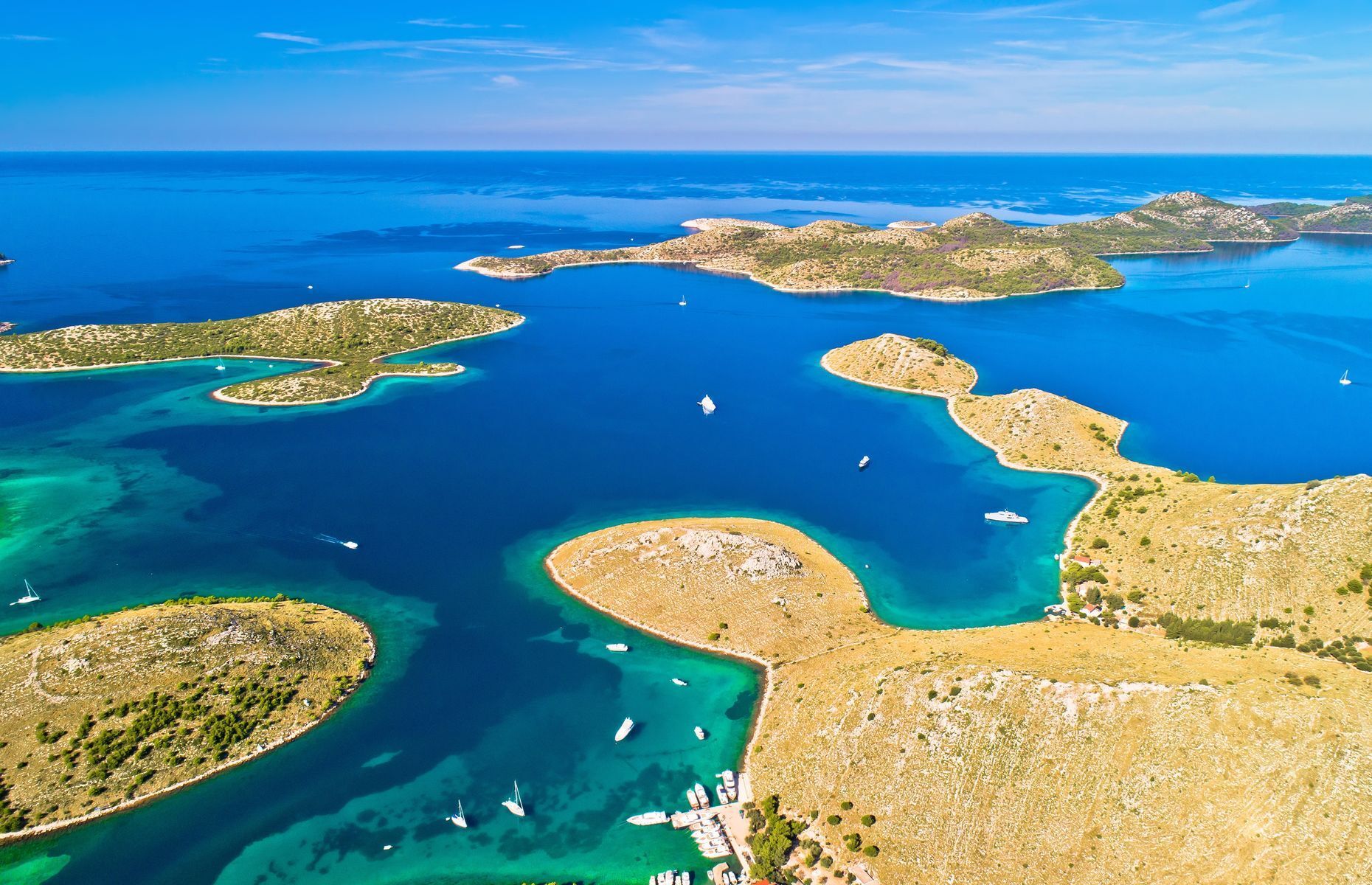 <a href="https://croatia.hr/en-gb/islands/kornati" rel="noreferrer noopener">Kornati National Park’s</a> 89 islands form a marine labyrinth in the middle of the Adriatic Sea off the Dalmatian coast. Its isolated location, Mediterranean climate, and wild, rugged landscape make it a magical destination for nature lovers. In addition to breathtaking hikes, intrepid travellers can also enjoy diving and boating. Visit traditional fishing villages as well to sample local specialties.