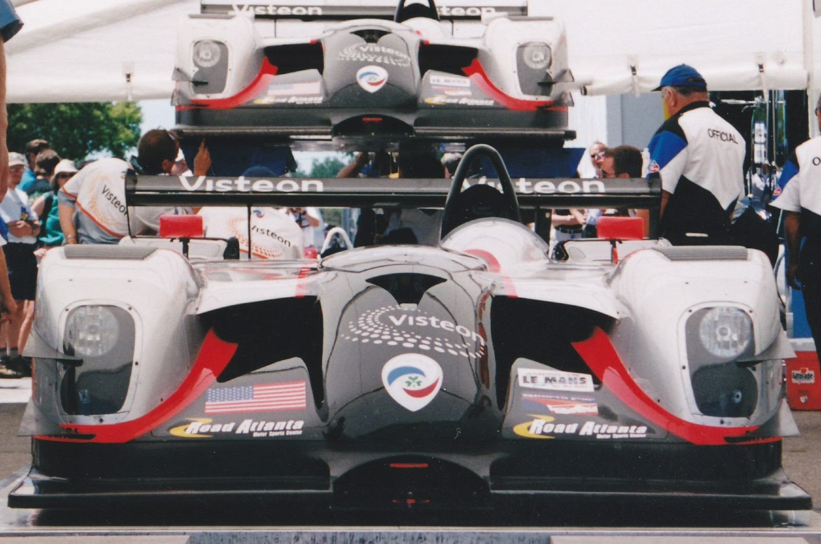 <p>The Panoz LMP-1 is a late ‘90s race car designed as the successor of the Esperante GTR-1. It stands out for its unconventional engine layout, with the front-mounted 6.0-liter V8 engine challenging the typical design of racing vehicles. In many ways, the Panoz LMP-1 comes full circle from Lance Reventlow’s front-engined Scarab F1.</p><p>The Panoz LMP-1 achieved a noteworthy performance in the 1999 24 Hours of Le Mans with seventh and eighth place finishes and won the IMSA Manufacturer’s Championship that same year. Despite its eventual retirement in 2003, the LMP-1 is still remembered for its unconventional design choices and performance in the American Le Mans Series.</p>