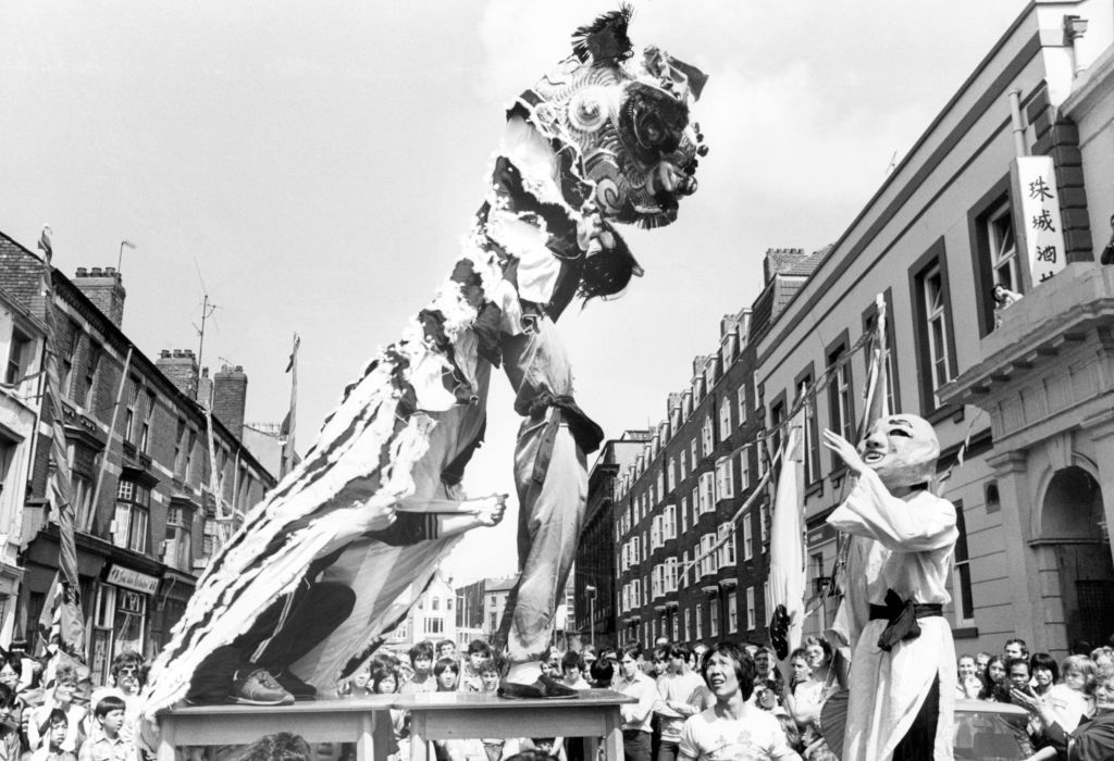 <p>The U.K. sure knows how to party. Celebrations continued throughout the area, including Liverpool's Chinatown. Here, the Lian Dancing Troupe perform a special routine in honor of the newlyweds.</p>