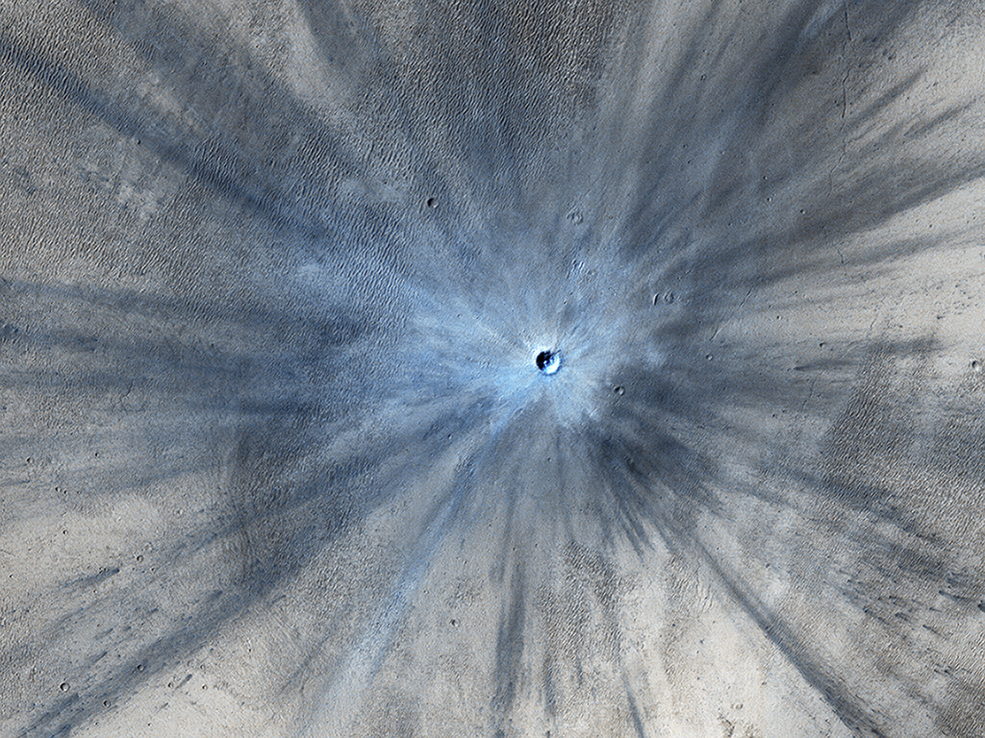 Esta imagem de uma cratera de impacto em Marte foi capturada por um orbitador, uma nave espacial orbital reutilizável do programa do ônibus espacial da NASA, a agência espacial dos Estados Unidos.