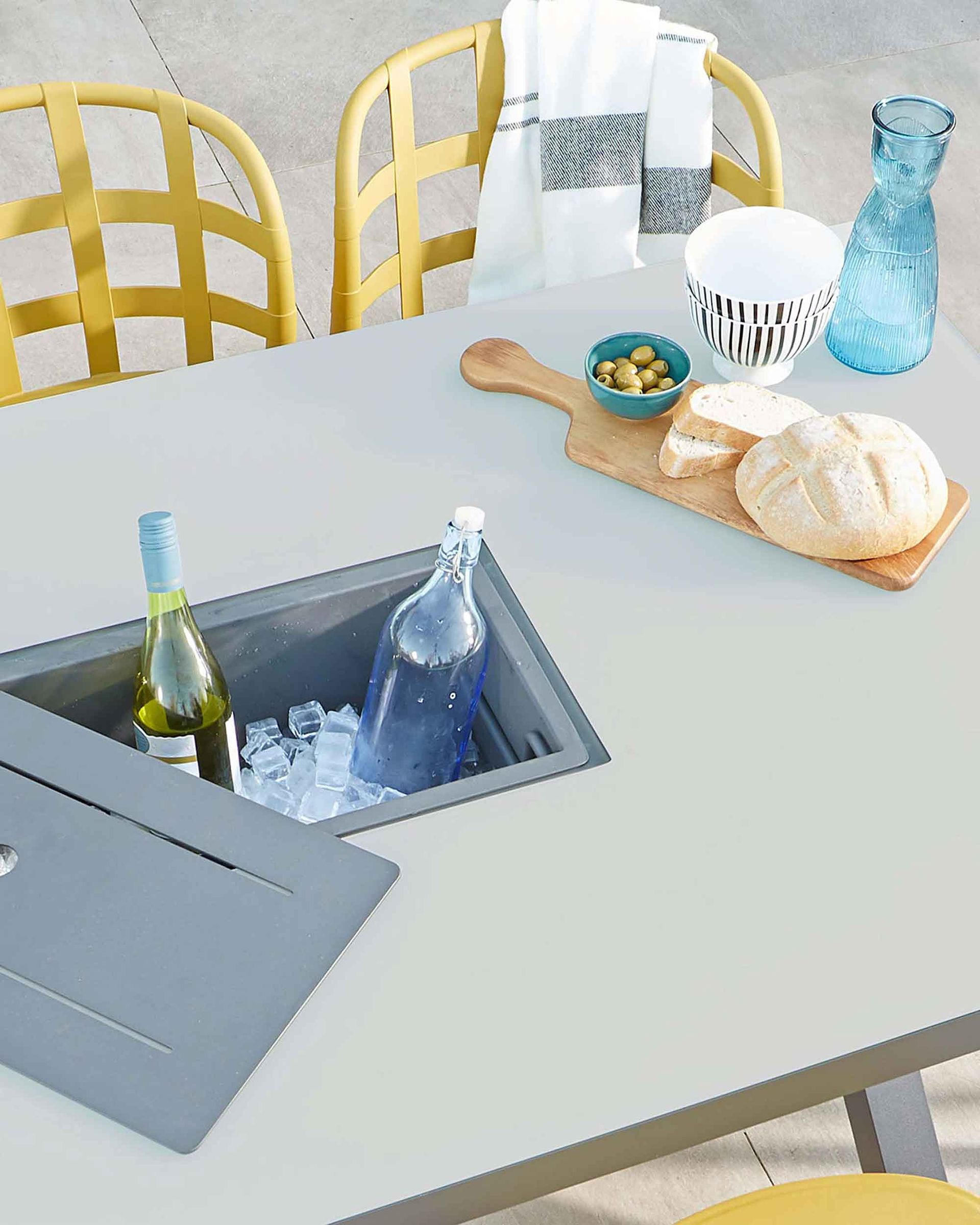 <p>                     Want to go one step further? Opt for stylish garden tables that have an ice bucket built in. That way, you'll never have to break away from the party to grab a fresh bottle from indoors.                   </p>                                      <p>                     This sleek design makes a great addition to a relaxed evening with friends on the patio. And, for every-day use, the cover can be slotted back in to make more space.                   </p>