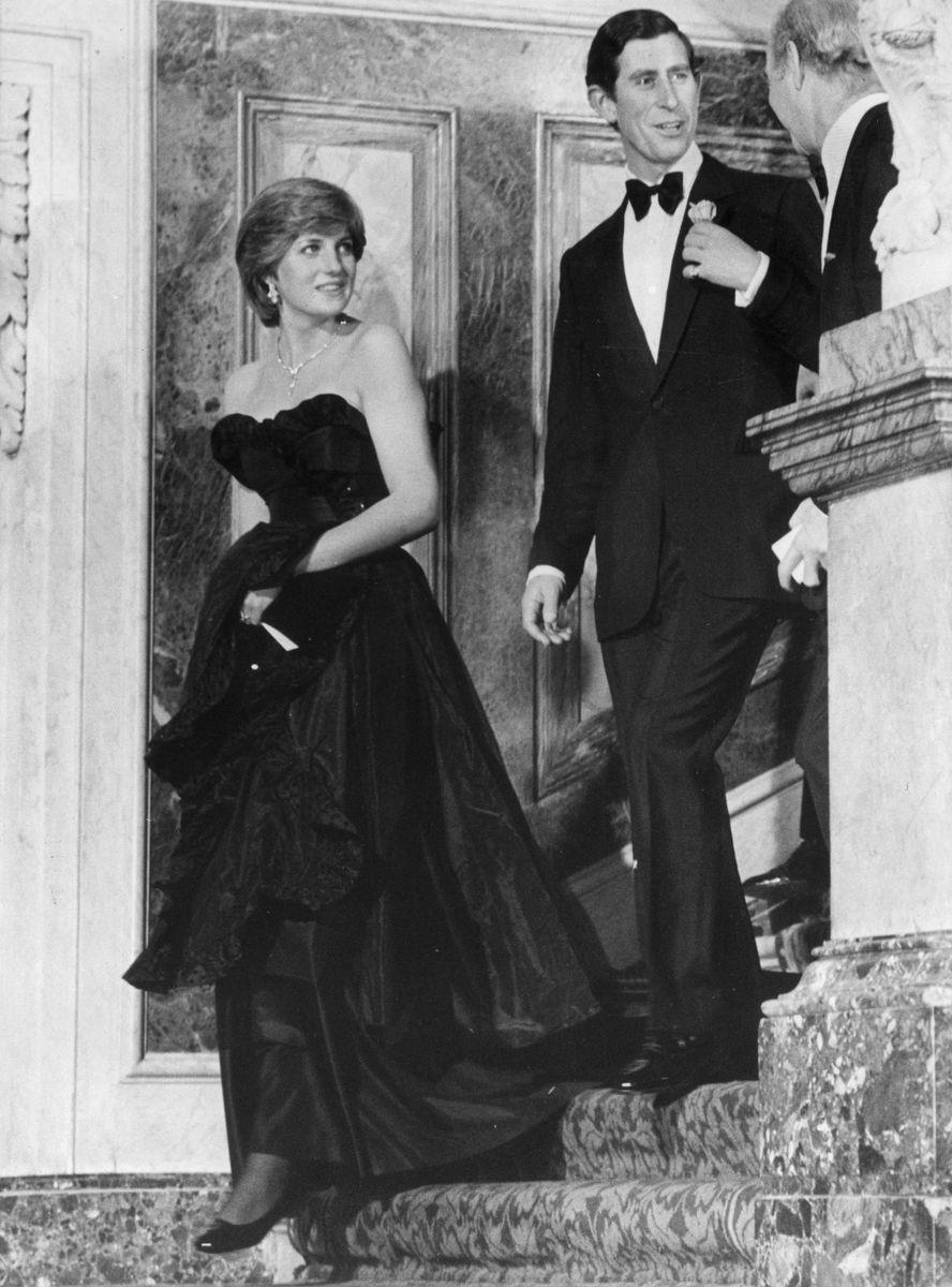 <p>Now <em>that's </em>how you tell the world you're off the market! Princess Di looked absolutely gorggg in a strapless black dress during her first night out as an engaged woman<em>. </em>The pair, who announced their engagement just two weeks earlier, were attending a recital at London's Goldsmith's Hall.</p>