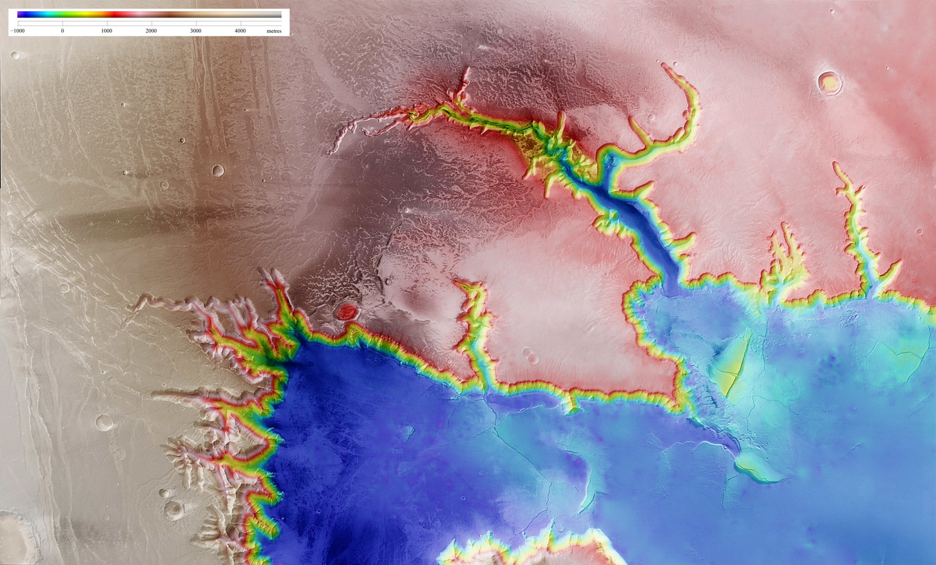 Esta imagem mostra uma vista aérea do Echus Chasma, uma das maiores regiões com fontes de água de Marte.