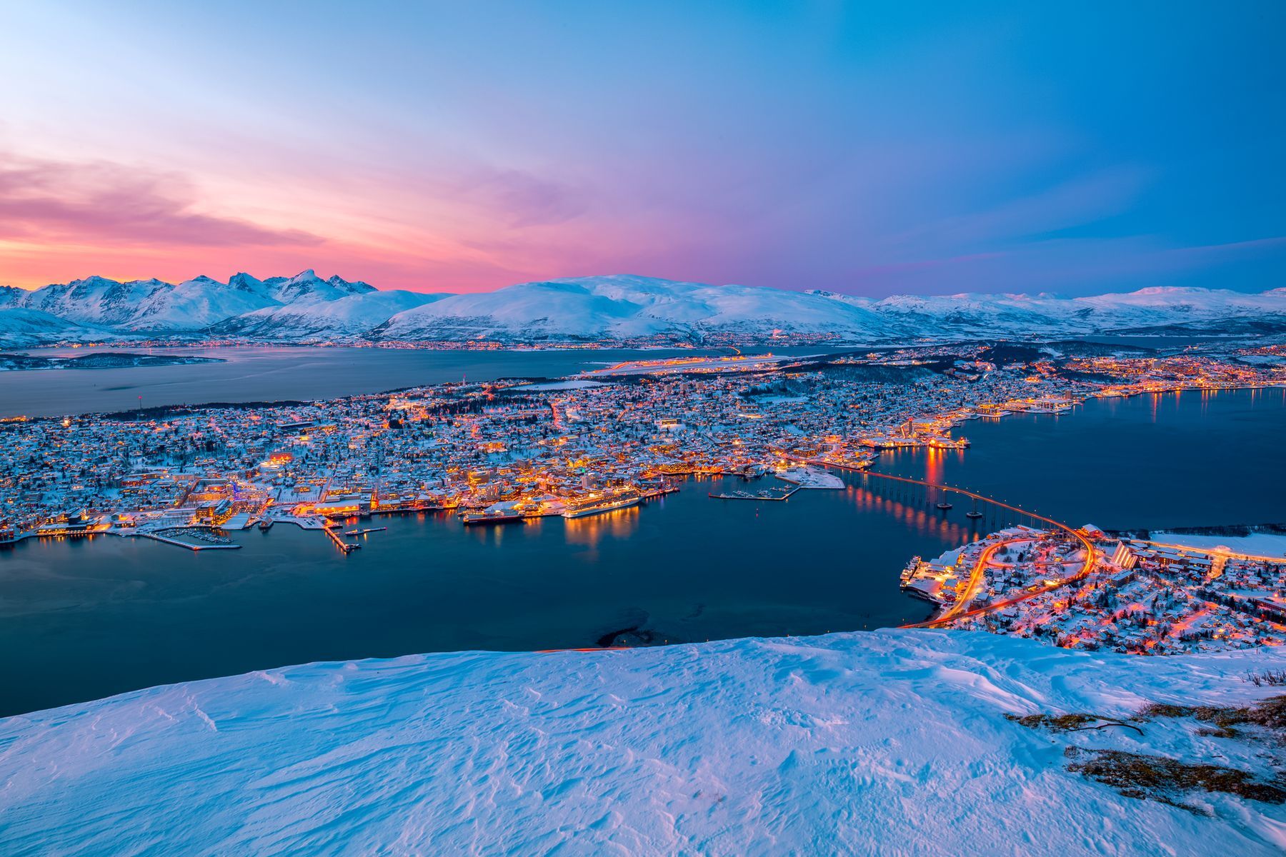 Discover the fascinating Norwegian city of <a href="https://www.visitnorway.com/places-to-go/northern-norway/tromso/?lang=usa" rel="noreferrer noopener">Tromsø,</a> nicknamed “the gateway to the Arctic.” Its maritime charm and polar climate make it the ideal destination for dog sledding, whale watching, admiring the northern lights, and other winter activities. Don’t forget to visit the <a href="https://visitnordic.com/en/attraction/polaria-museum" rel="noreferrer noopener">Polaria Museum</a> to learn more about Nordic life near the Arctic Circle and be sure to stop by the uniquely designed Arctic Cathedral.