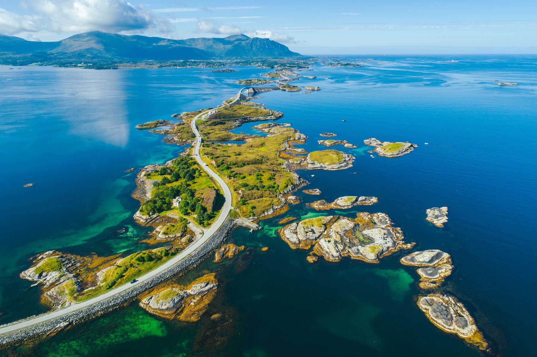 Among Norway’s national tourist routes, the Atlantic Ocean Road (<a href="https://www.visitnorway.com/places-to-go/fjord-norway/northwest/listings-northwest/norwegian-scenic-routes-the-atlantic-road/11862/?lang=usa" rel="noreferrer noopener">Atlanterhavsvegen</a>) is undeniably the most spectacular. This motorway extends for just over eight kilometres (five miles) and serves as an important artery for both fishers and those venturing into the northern islands. You’ll find rugged coastlines, bucolic villages, and the Troll Church caves along the way.