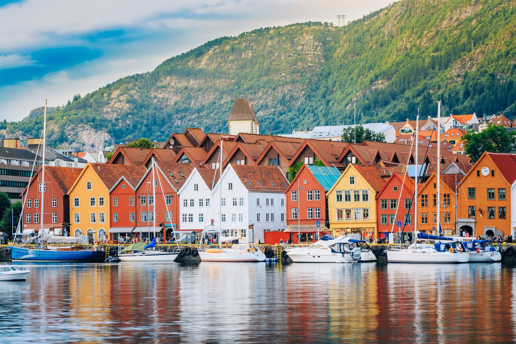 Located in southwest Norway, <a href="https://www.visitnorway.com/places-to-go/fjord-norway/bergen/?lang=usa" rel="noreferrer noopener">Bergen</a> is a picturesque town bordered by fjords and mountains. Main attractions include a historical district listed as a UNESCO World Heritage Site and the Fløyen funicular offering gorgeous panoramic views. Visitors to the country’s second-largest city should also explore its art museums and stroll along the old port to admire its colourful houses.