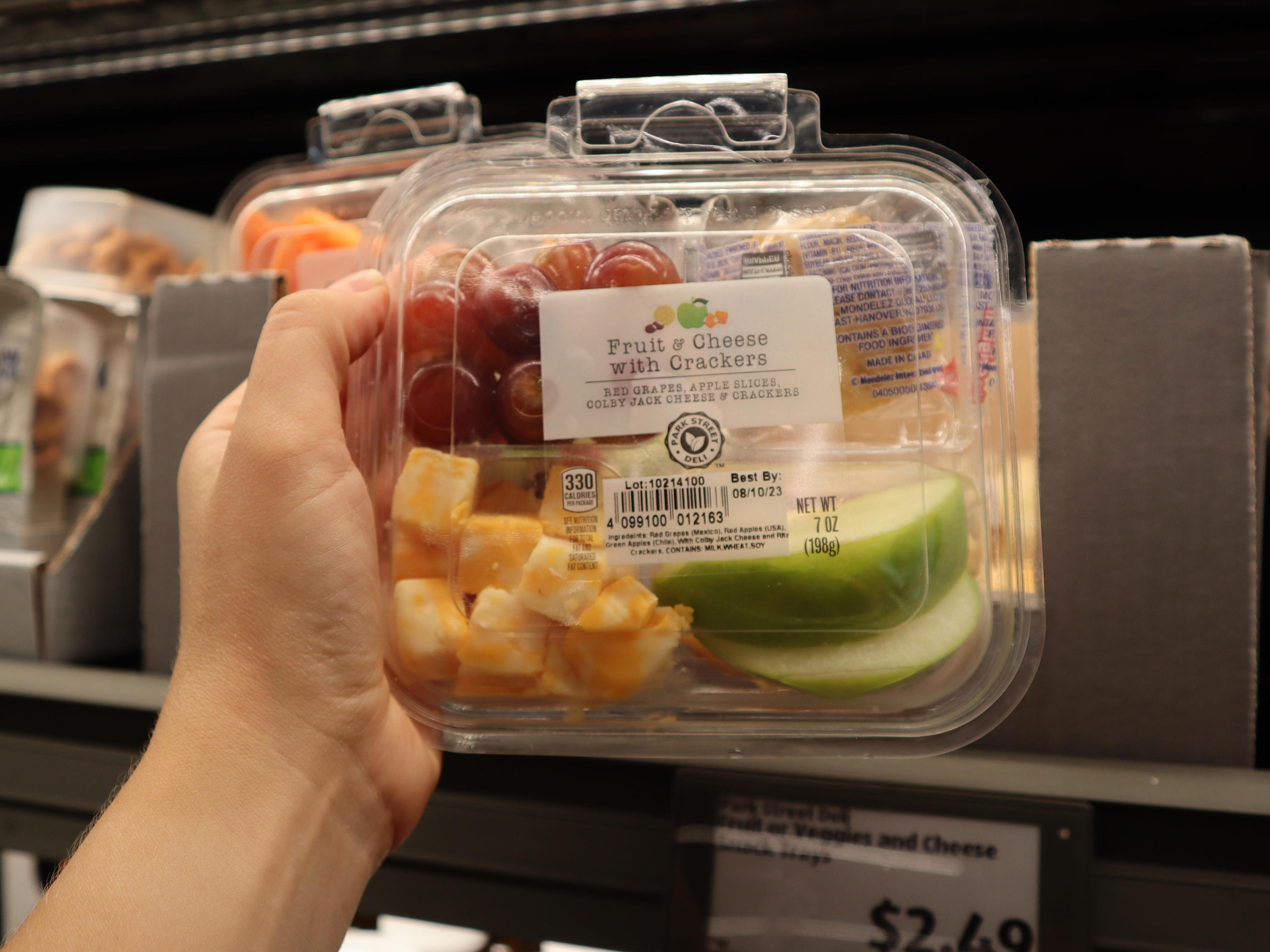 <p>My partner and I try to avoid purchasing any food or drinks on planes by bringing our own snacks.</p><p>We like to pick up the Park Street Deli fruit, cheese, and cracker trays, which cost $2.50, or the meat, cheese, and breadstick Italian snack trays, which cost about $3.</p><p>Whichever we choose, packing them <a href="https://www.insider.com/best-tips-grocery-shopping-budget-aldi-employee">saves us from wasting money</a> and time waiting for the drink cart to reach our row.</p>