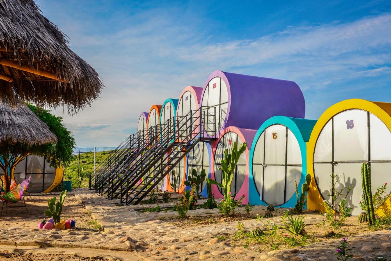 <p>At <a href="https://www.expedia.com/Villavieja-Hotels-Tubo-Hotel-La-Tatacoa.h42306722.Hotel-Information">TuboHotel La Tatacoa</a>, guests are able to combine both the experience of camping with real beds and permanent facilities. Each room is located inside of a concrete tube featuring a small window, black out curtains, and a queen-sized bed. Painted vibrant hues, the suites sit on a campground with a community pool, bar/restaurant pavilion, and communal bathrooms. The unique camping spot is located in Villavieja, a town in within the Tatacoa Desert and built on the banks of the Magdalena River.</p> <p><em>Book now: <a href="https://www.expedia.com/Villavieja-Hotels-Tubo-Hotel-La-Tatacoa.h42306722.Hotel-Information">TuboHotel La Tatacoa</a></em></p><p>Sign up for our newsletter to get the latest in design, decorating, celebrity style, shopping, and more.</p><a href="https://www.architecturaldigest.com/newsletter/subscribe?sourceCode=msnsend">Sign Up Now</a>
