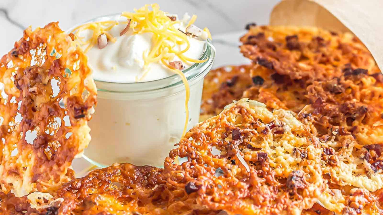 <p>Give in to your cheesy cravings with these crispy and irresistible cheese bacon chips. Indulge in the perfect combination of salty bacon and gooey melted cheese that will leave you craving for more. Snack time just got a whole lot more exciting!<br><strong>Get the Recipe: </strong><a href="https://www.lowcarb-nocarb.com/keto-cheese-bacon-chips/?utm_source=msn&utm_medium=page&utm_campaign=msn">Cheesy Cravings Bacon Chips</a></p>