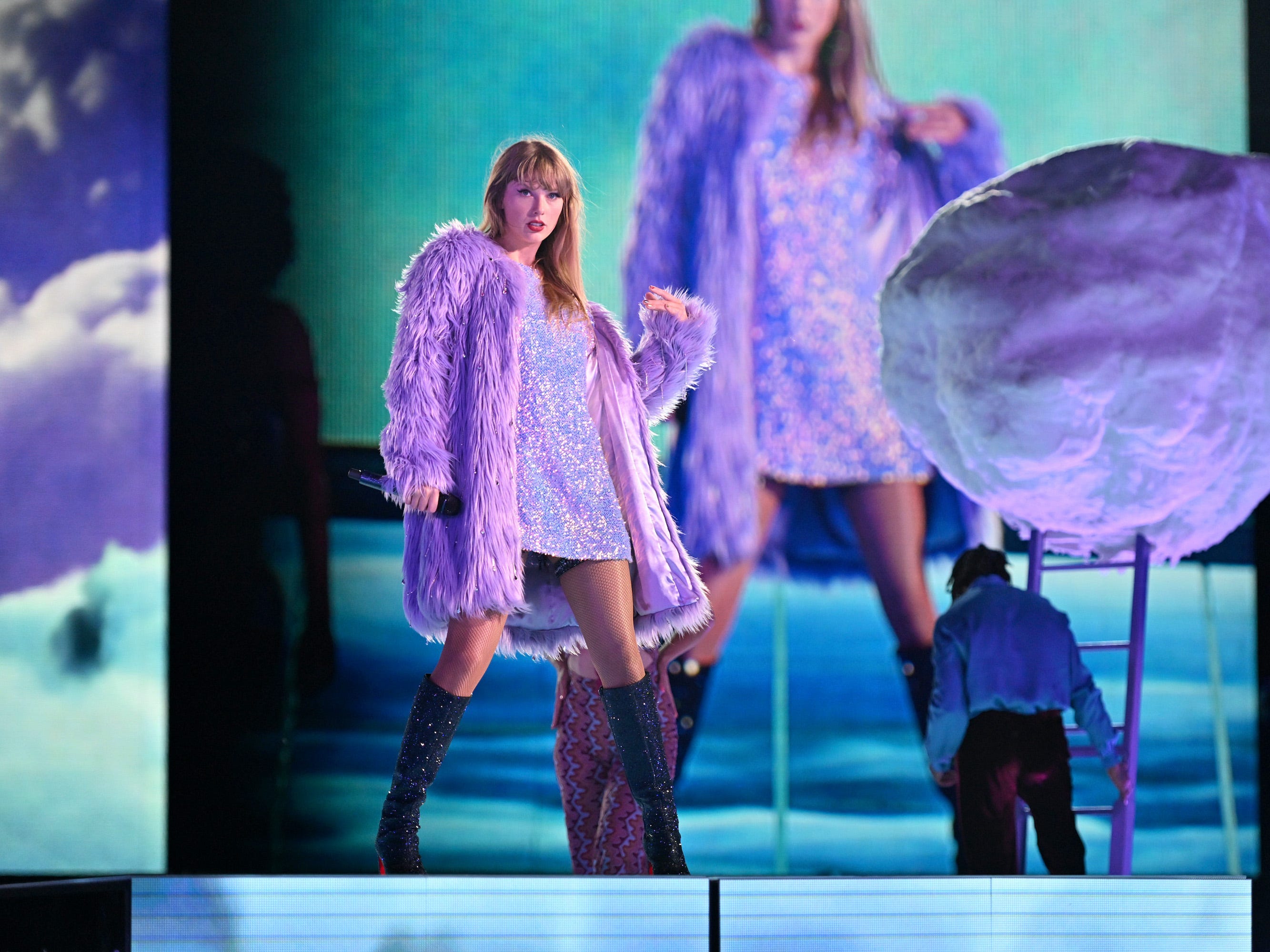 <p>The fuzzy coat that opens the "Midnights" segment is a reference to <a href="https://www.businessinsider.com/taylor-swift-lavender-haze-music-video-details-easter-eggs-2023-1">the "Lavender Haze" music video</a>. This connection is most obvious when Swift wears the opalescent T-shirt dress underneath.</p><p>It kind of looks like Swift skinned a muppet to make this coat, but don't worry: she <a href="https://www.insider.com/taylor-swift-lavender-haze-video-behind-the-scenes-2023-3">confirmed in a behind-the-scenes clip</a> that she would never wear real fur.</p>