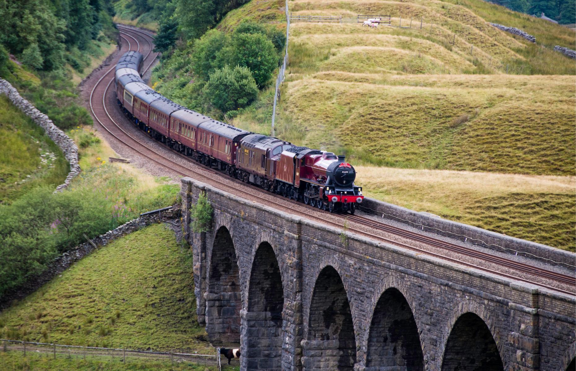Known as the birthplace of train travel, taking a trip across the UK by rail is the ultimate way to explore its breathtaking natural beauty and incredible attractions. From epic cross-country adventures to shorter heritage steam trains across the idyllic countryside and pretty coastlines, here we take a look at the most charming rail journeys in the UK.
