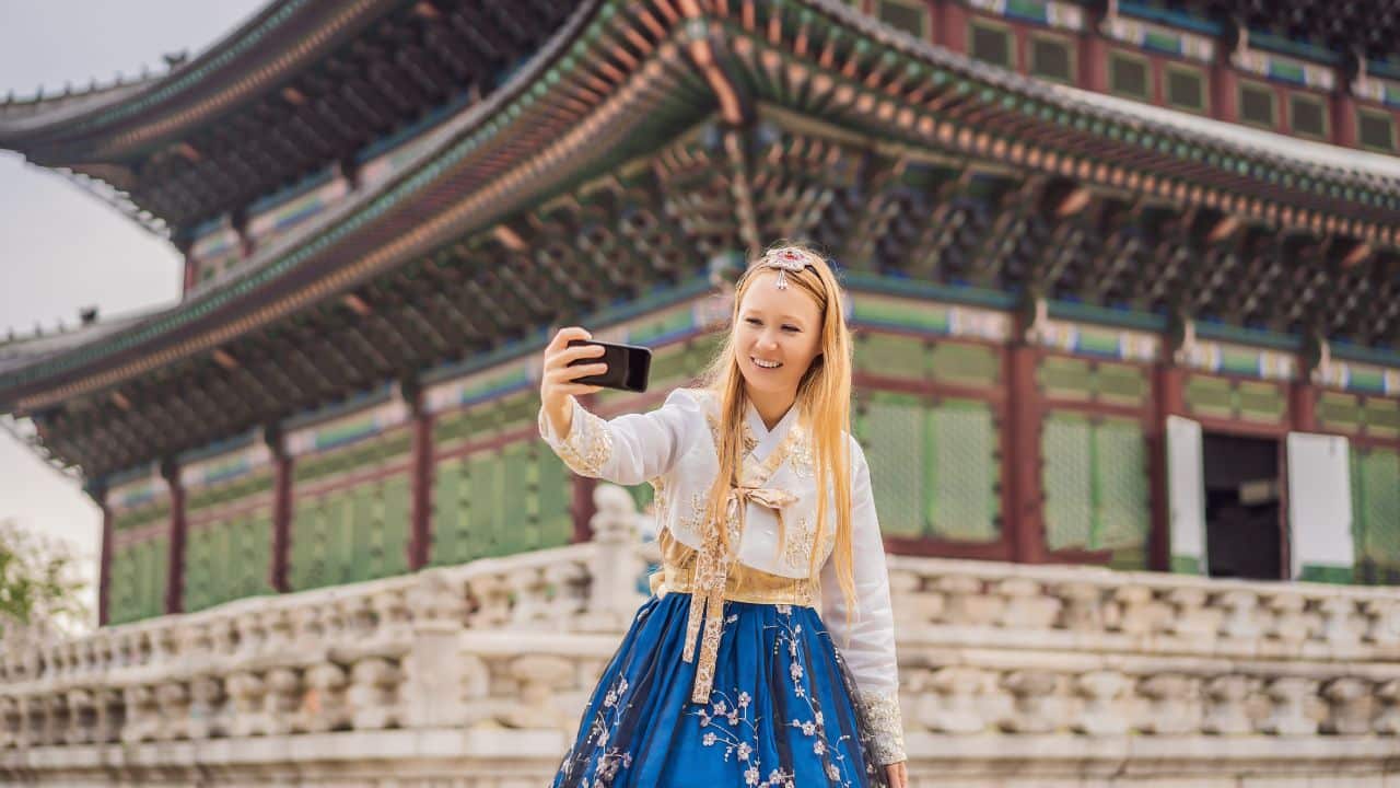 <p>The most anachronistic experience in Seoul is to rent a colorful hanbok to wear as you stroll the grounds of Gyeongbokgung or Changdeokgung palaces. The flowing <em>chima</em> (skirt) or <em>baji</em> (trousers) paired with the short <em>jeogori</em> (jacket) creates a classic silhouette against the backdrop of the 14th-century palaces and makes for stunning Instagrammable content.</p><p>Don’t miss the changing of the royal guard ceremony at <a href="http://www.royalpalace.go.kr:8080/html/eng_gbg/main/main.jsp">Gyeongbokgung Palace</a>, and be sure to check out the idyllic Secret Garden when visiting <a href="https://whc.unesco.org/en/list/816/">Changdeokgung Palace</a>. As a bonus, anyone wearing a hanbok gets free entry into the palace grounds.</p><p>Note: The palaces are open all year, but for the most beautiful Seoul weather, plan your visit for spring or fall.</p>