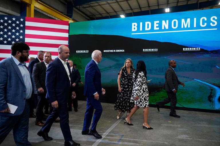 President Joe Biden, fourth form right, looks to Annie Tomasini, Assistant to the President & Senior Advisor to the President & Director of Oval Office Operations, third from right, as they leave Arcosa Wind Towers, Wednesday, Aug. 9, 2023, in Belen, N.M. (AP Photo/Alex Brandon)