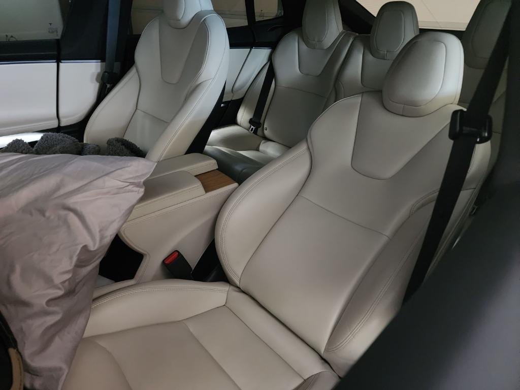 David Craig says all he needs to do is recline his seat, grab a pillow, and put the car in Camp Mode. <a>Courtesy of David Craig</a>