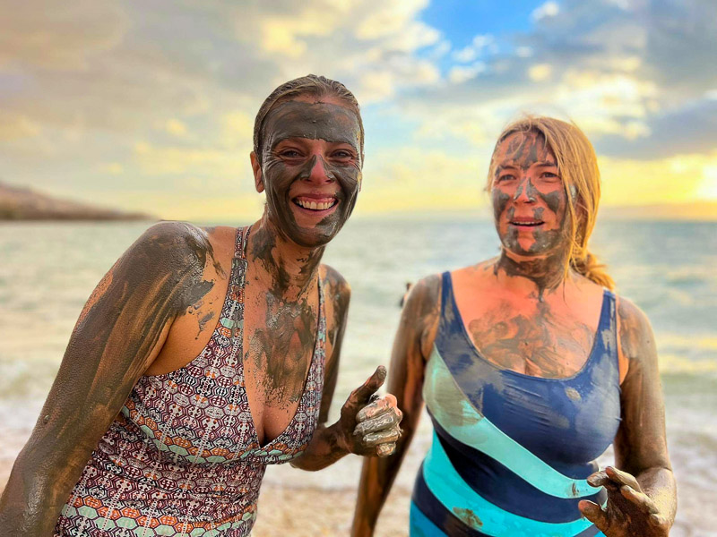 Mudding up with friends at the Dead Sea