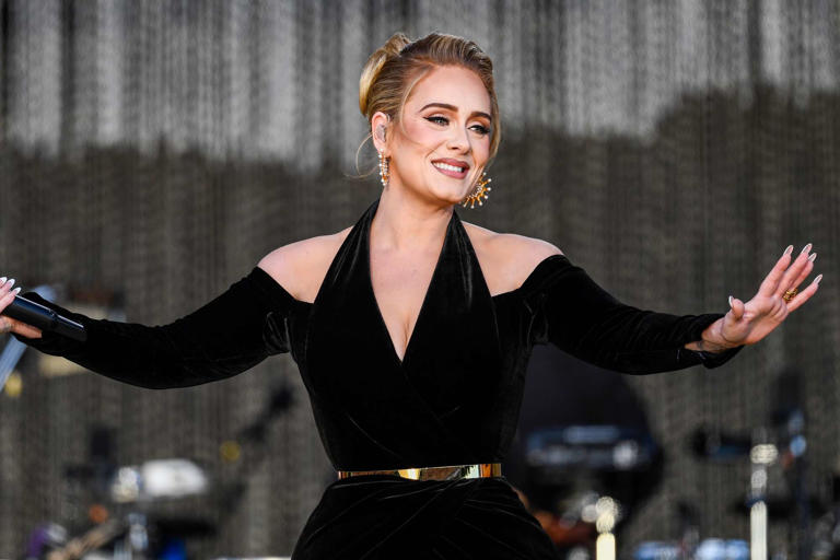 Gareth Cattermole/Getty Adele performs on stage in Hyde Park in July 2022 in London