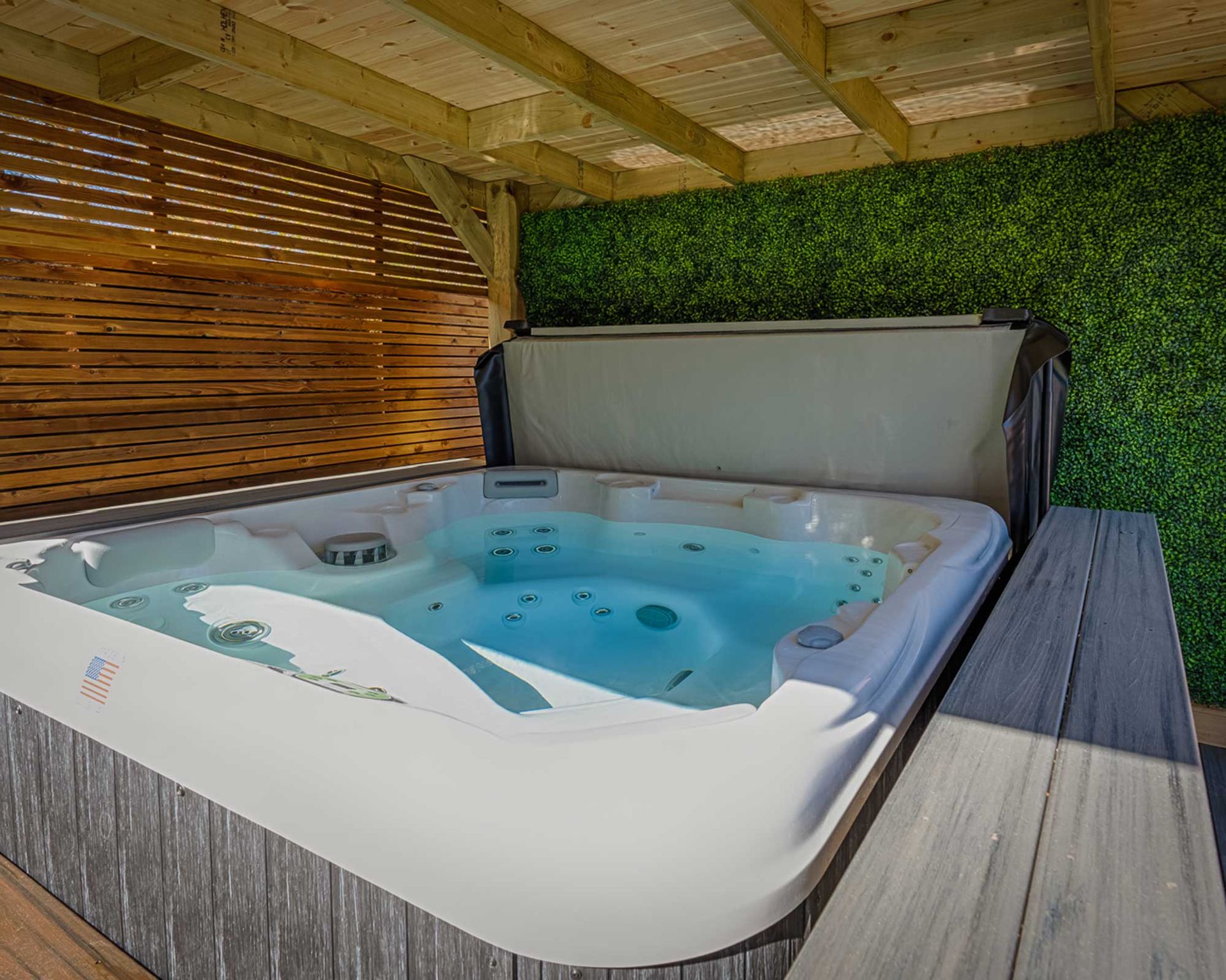 <p>                     If you're looking for hot tub privacy ideas to add to your zone, be it a sturdy fence, trellis, or wall, adding a splash of greenery will never go amiss.                   </p>                                      <p>                     You could opt for wall-hanging planters, or even create a living wall using a set of planting pockets, filled with scented herbs to up the sensory appeal. But, if you'd rather skip the maintenance, you could always opt for faux foliage instead, especially if your space doesn't get much sunlight.                   </p>